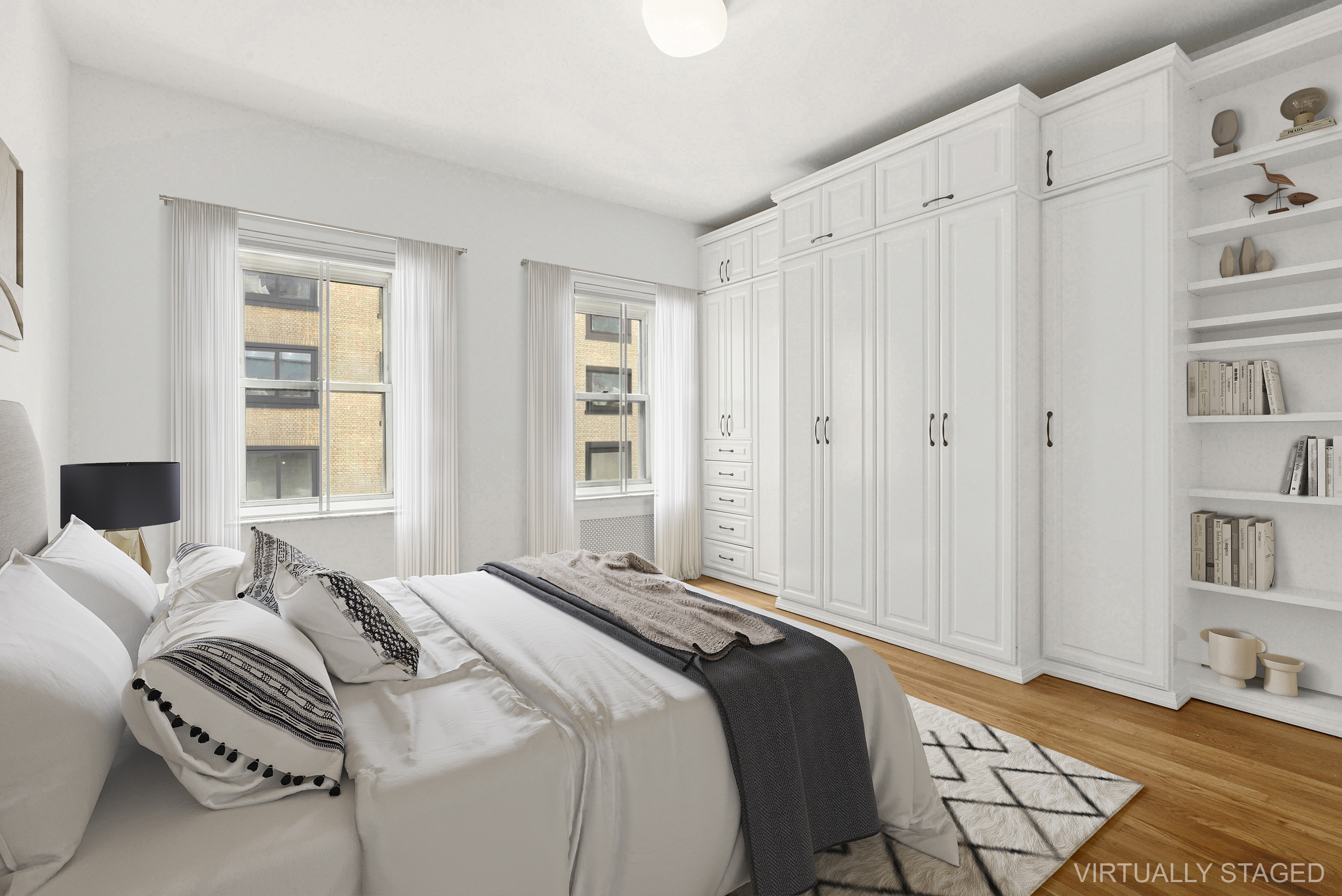 57 West 58th Street, Unit 10E Manhattan, NY 10019 - Photo 2 of 5 a bedroom with a bed and a window