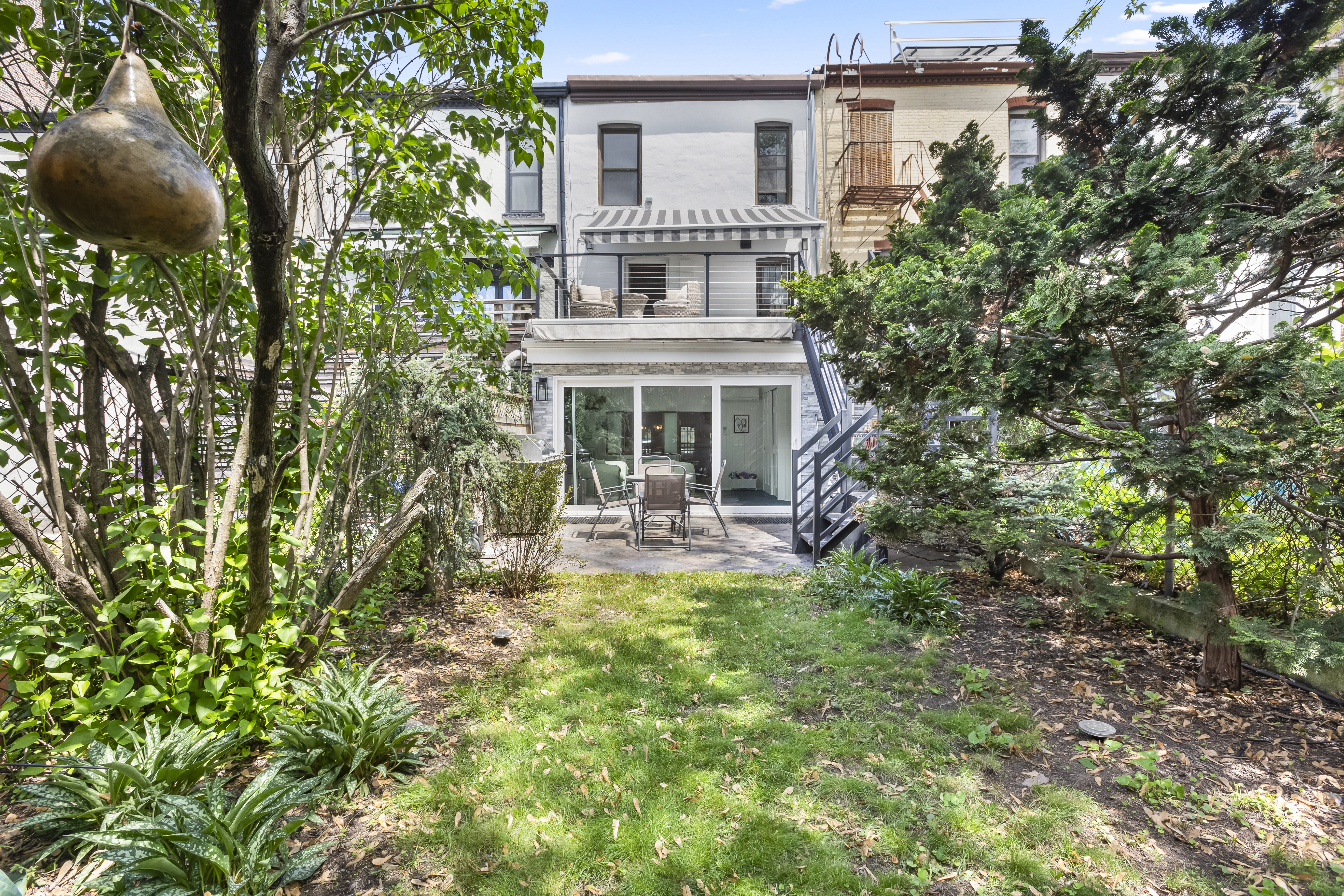 312 10th Street Brooklyn, NY 11215 - Photo 2 of 17 a view of house with a yard and potted plants