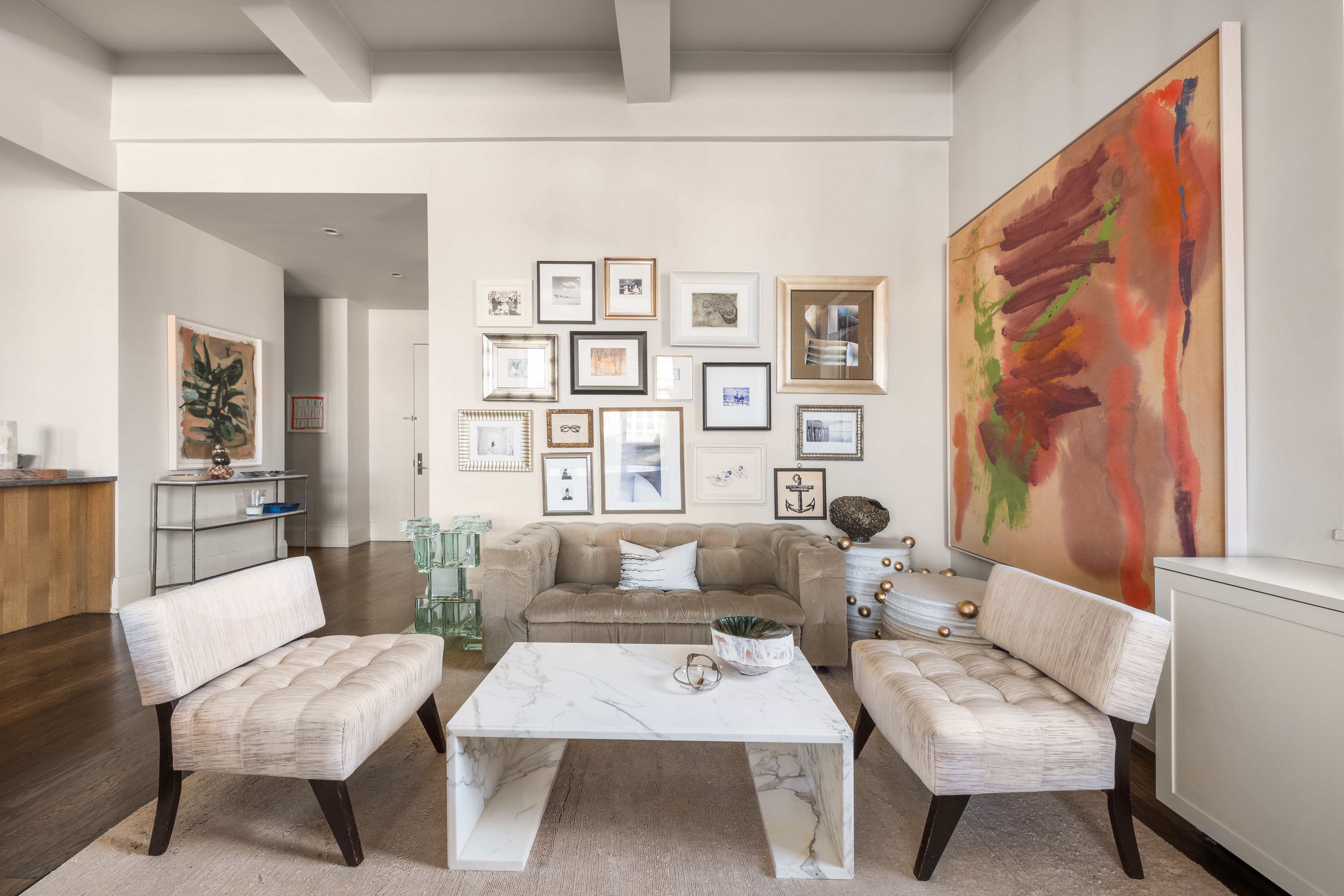 263 9th Avenue, Unit 7E Manhattan, NY 10001 - Photo 8 of 17 a living room with furniture a rug and a table