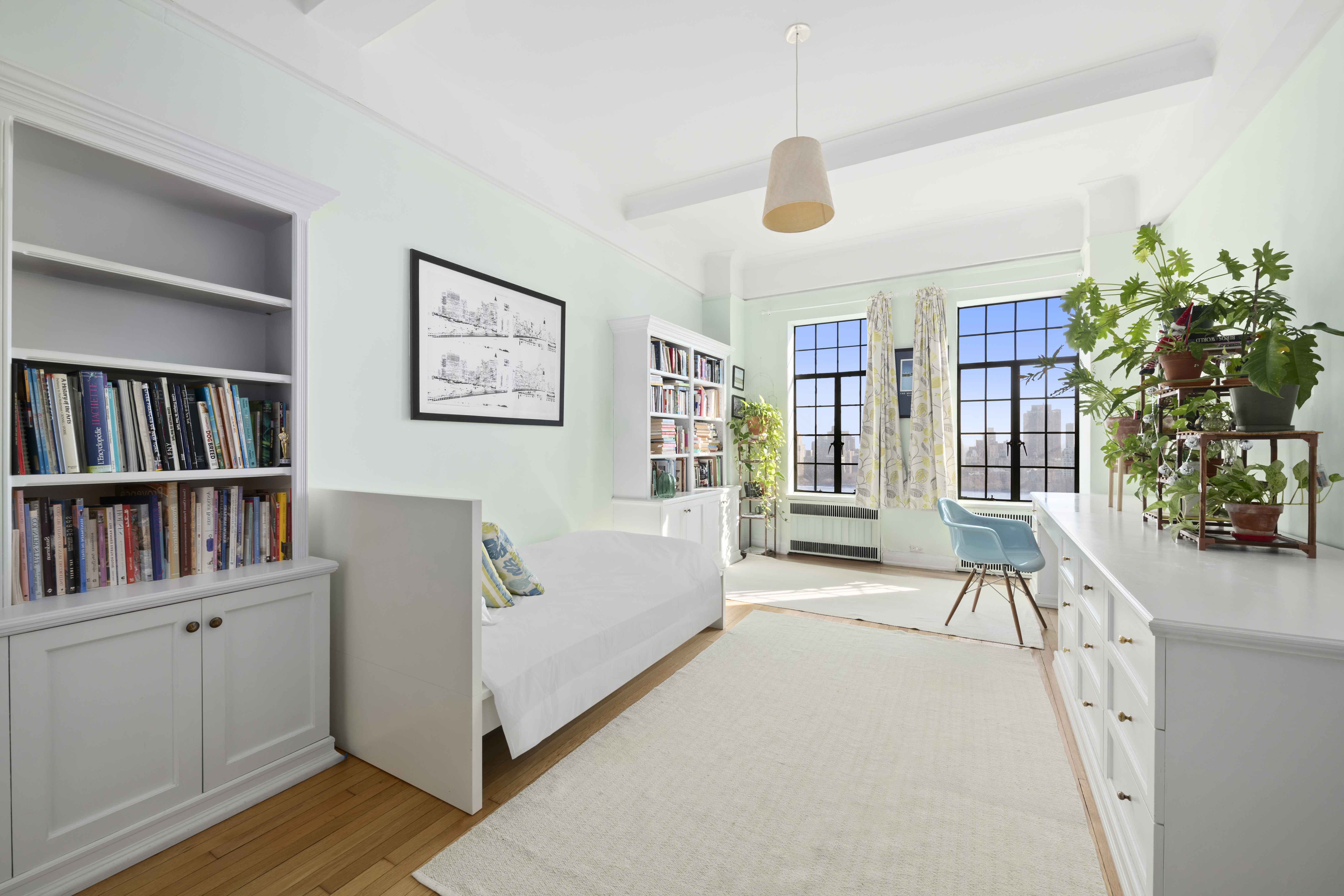 300 Central Park West, Unit 21G Manhattan, NY 10024 - Photo 14 of 21 a living room with furniture and a book shelf