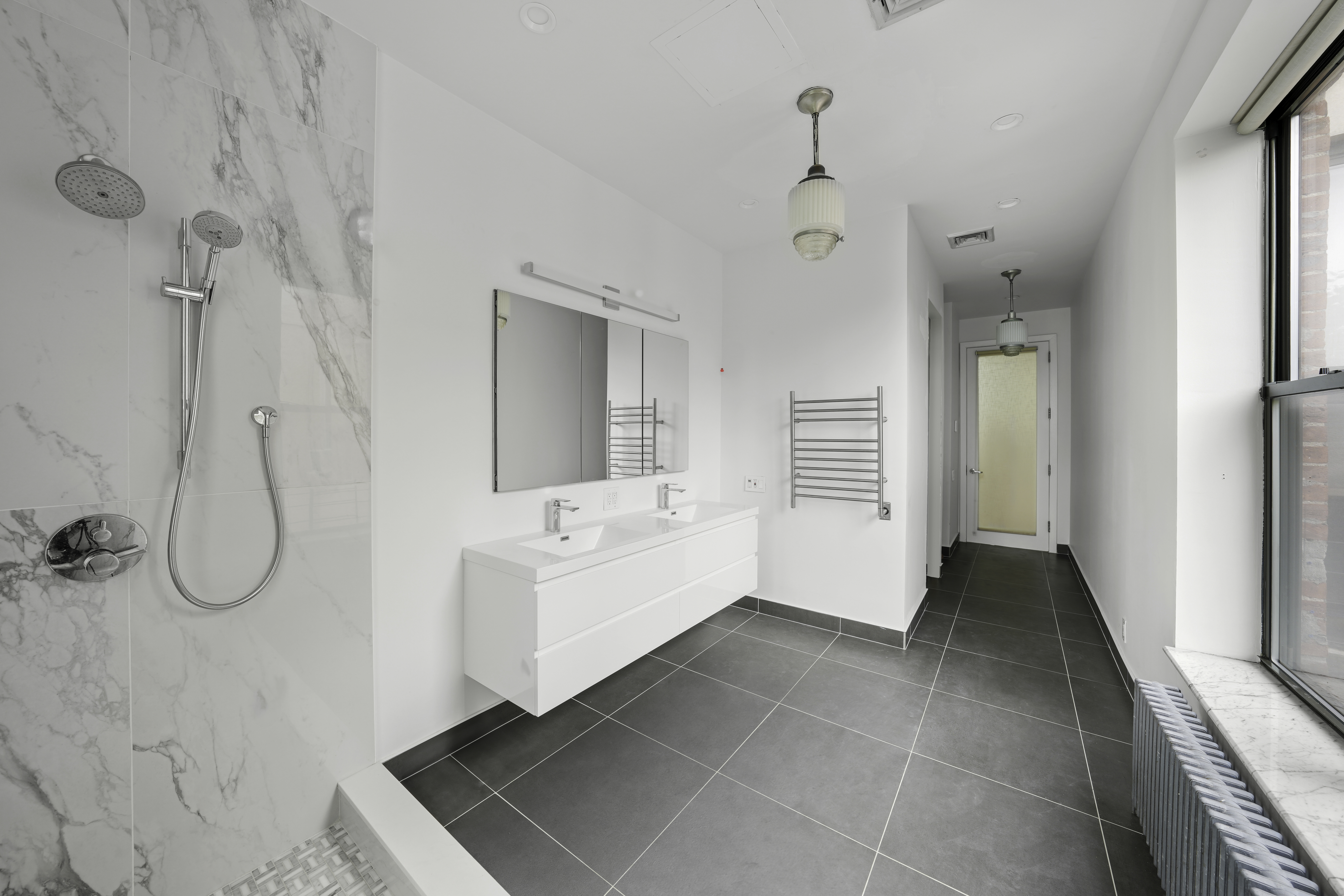 109 West 118th Street Manhattan, NY 10026 - Photo 21 of 31 a bathroom with a bathtub sink and mirror