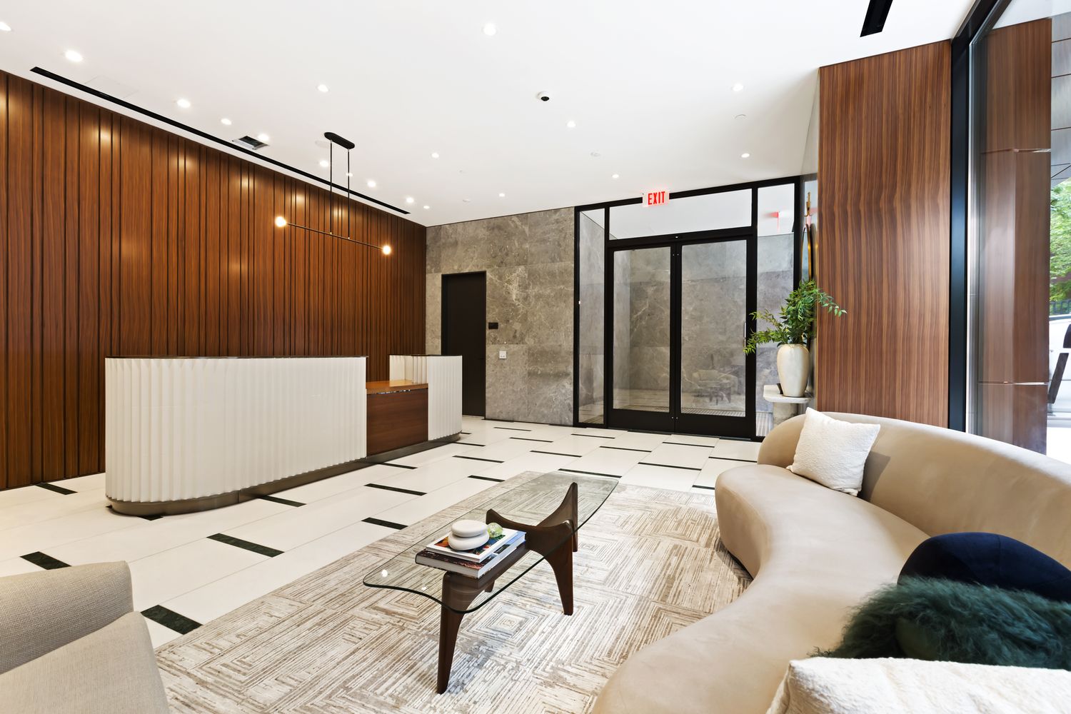 a living room with couches and furniture with wooden floor