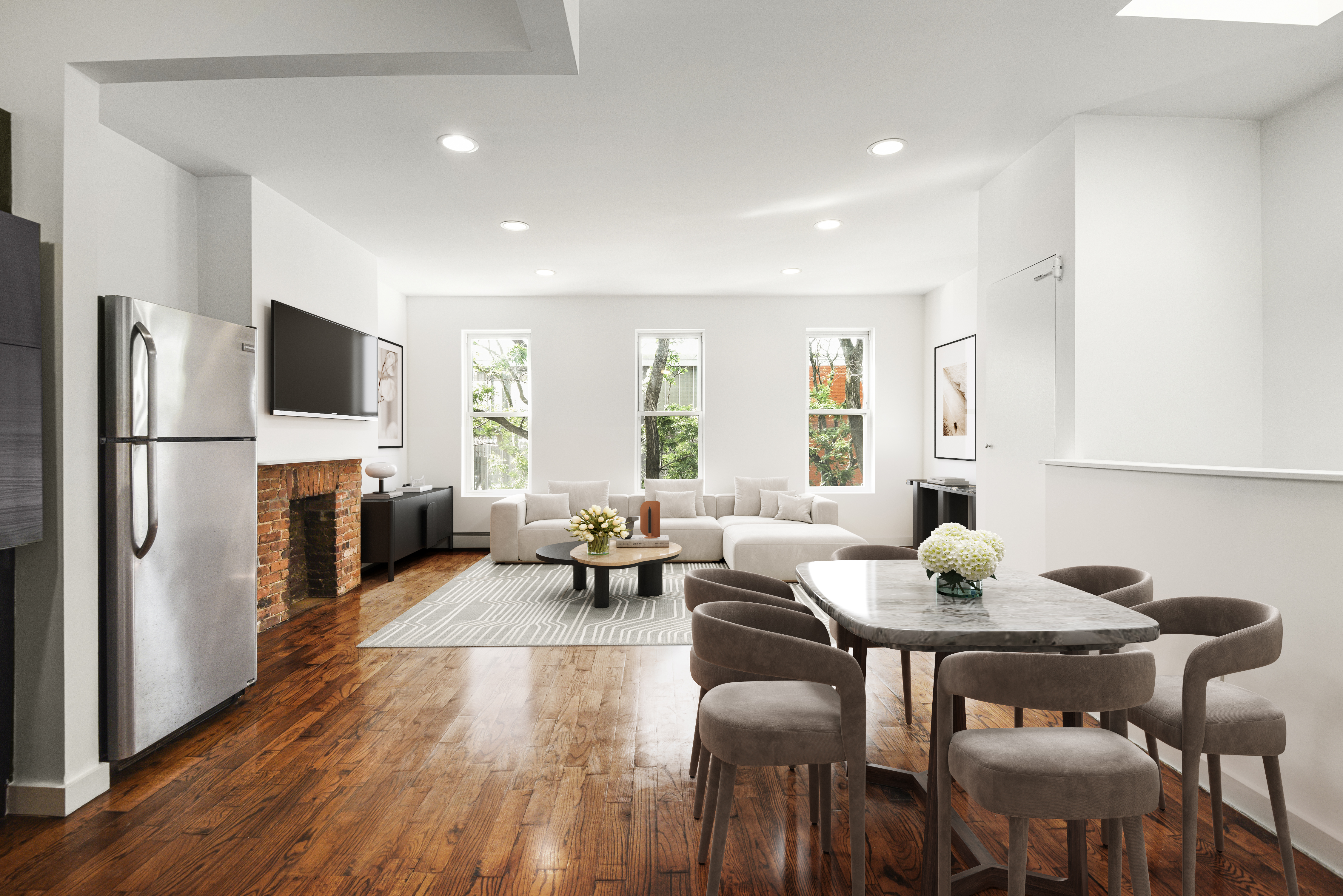 a living room with furniture wooden floor and a flat screen tv