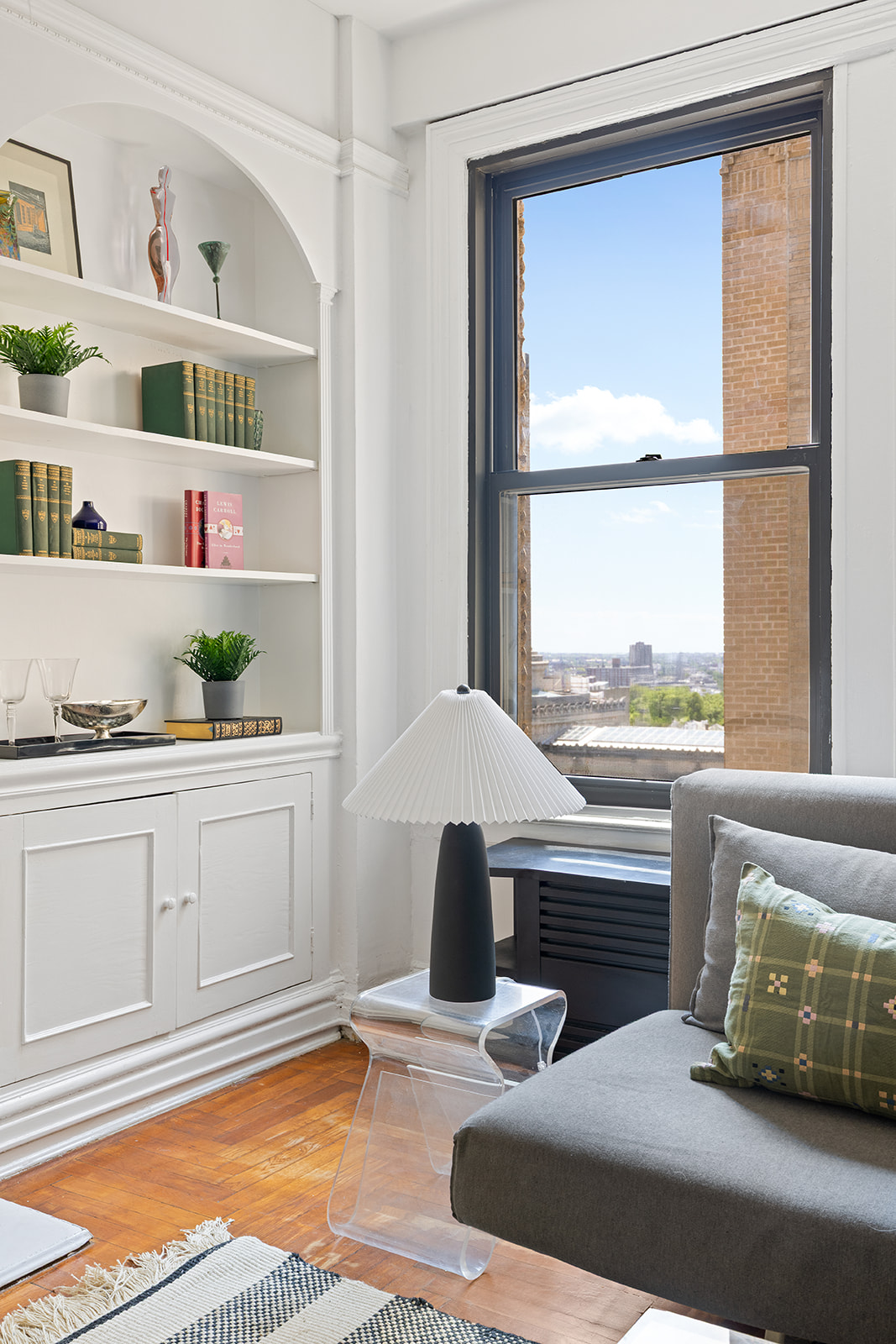 135 Eastern Parkway, Unit 14E Brooklyn, NY 11238 - Photo 6 of 16 a living room with furniture and a window