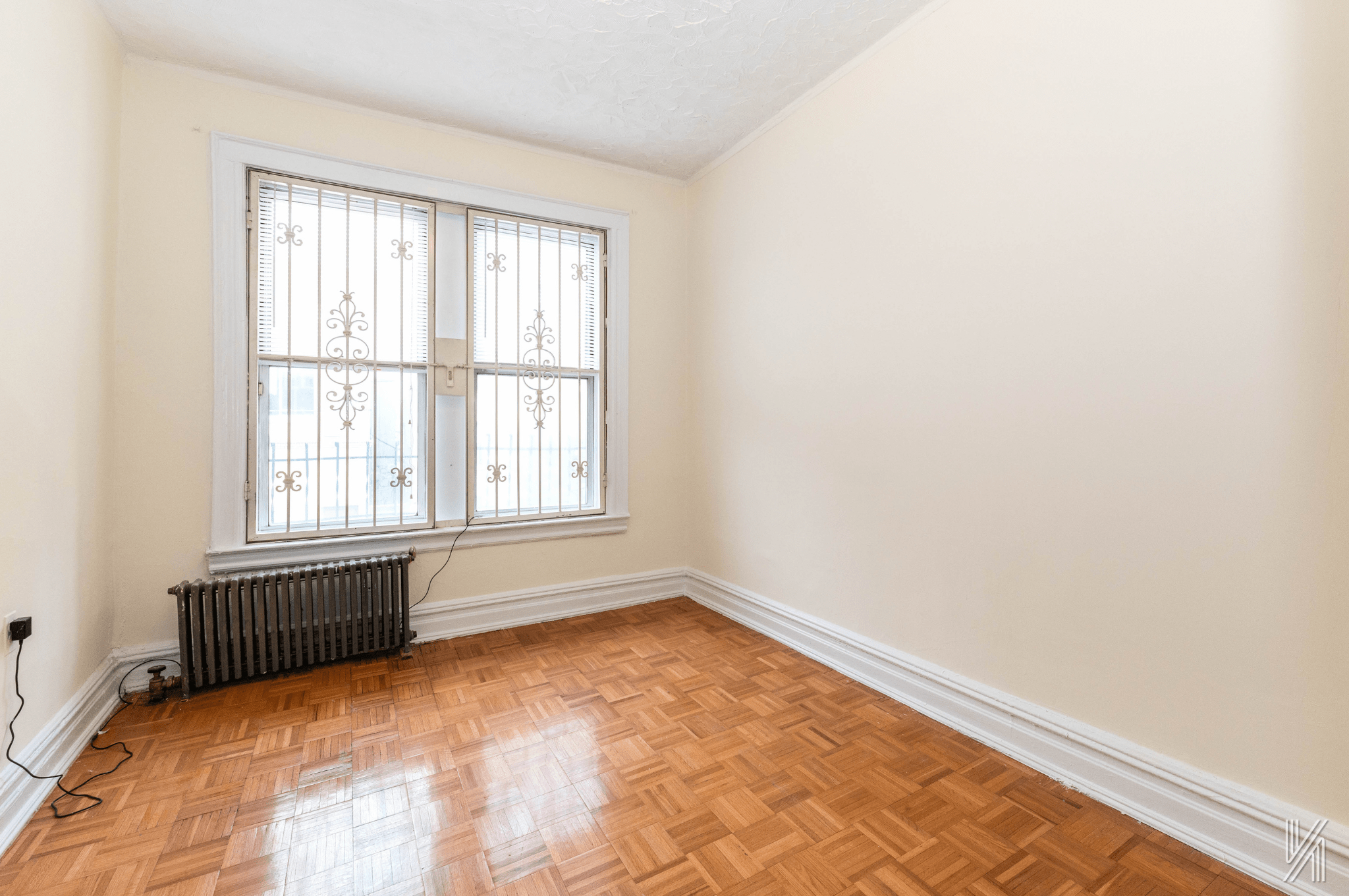 32-10 35th Street Queens, NY 11106 - Photo 11 of 29 a view of an empty room with a window