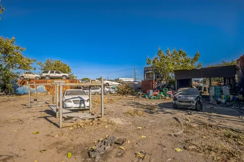 a view of a car park in front of the house