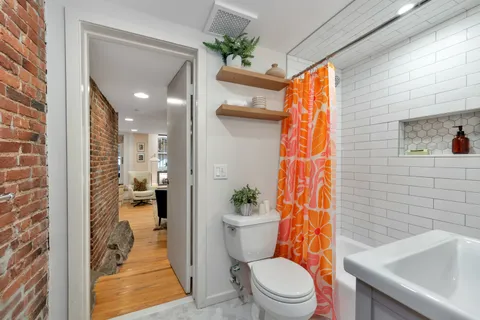a view of a livingroom with furniture and window