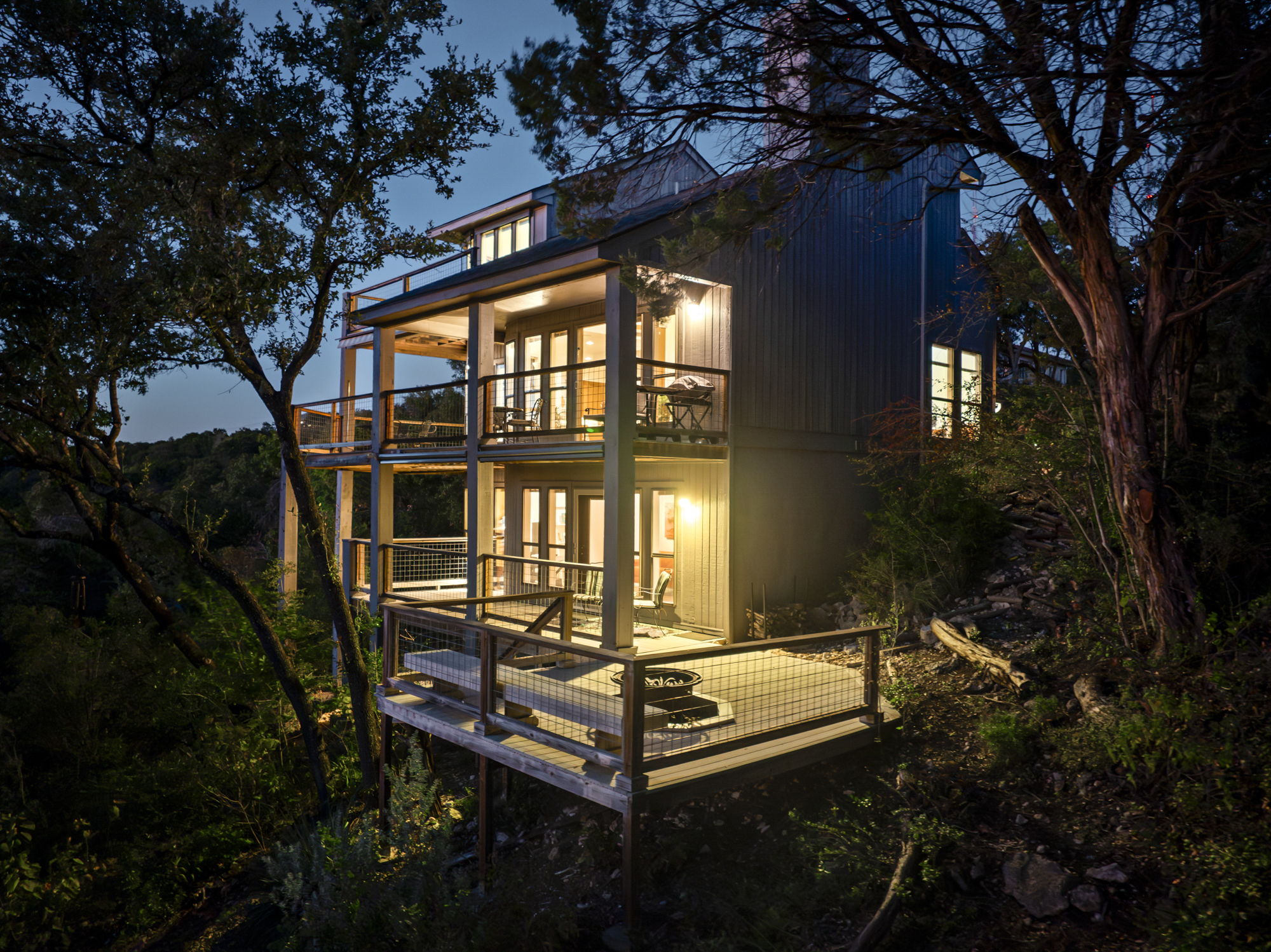 1605 The High Road Austin, TX 78746 - Photo 44 of 45 a view of a patio with table and chairs with wooden floor and fence