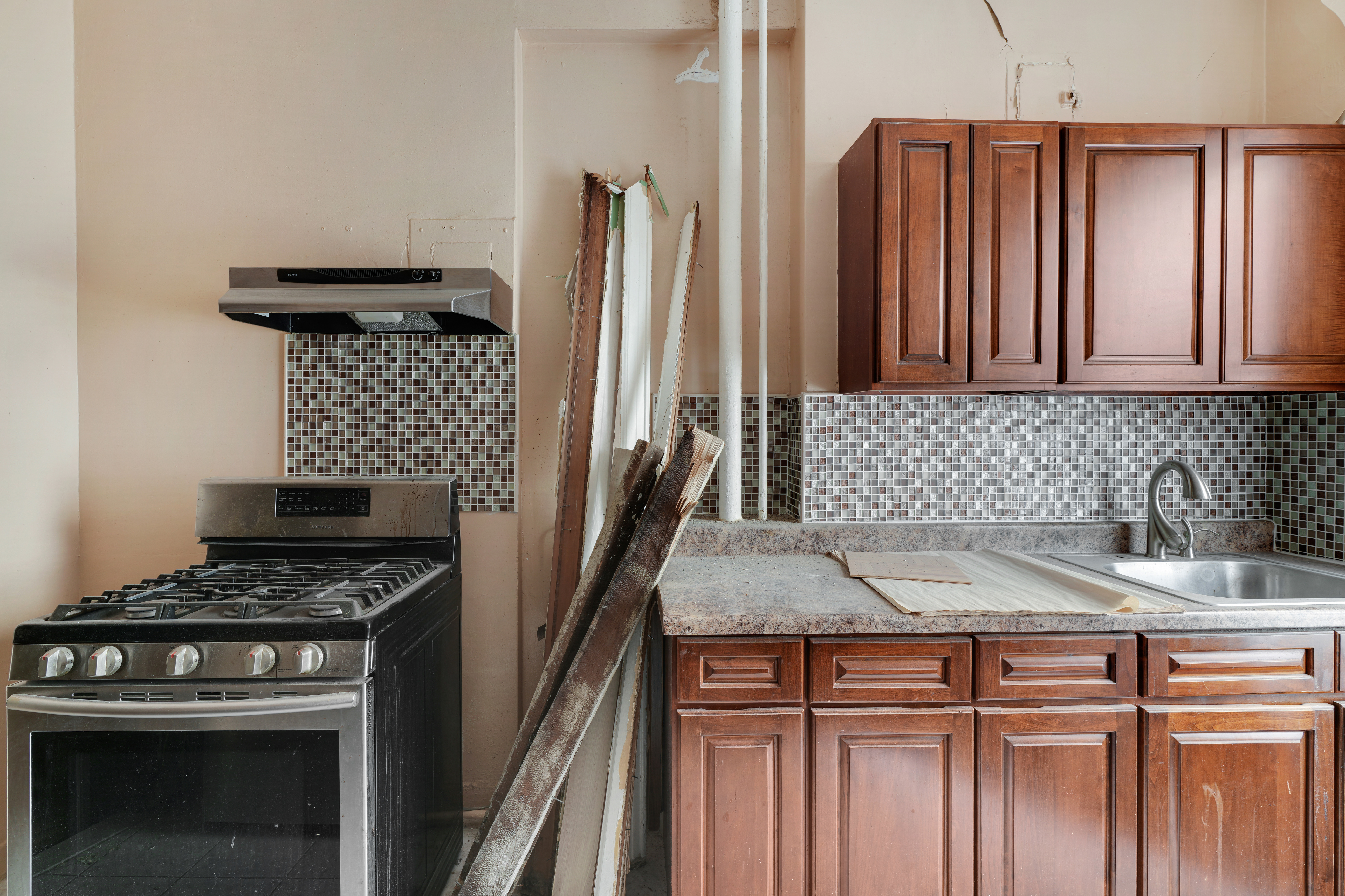 416 Ocean Avenue, Unit 62 Brooklyn, NY 11226 - Photo 2 of 22 a kitchen with granite countertop a sink stove and refrigerator