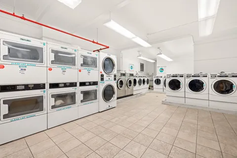 a view of a storage & utility room with washer and dryer