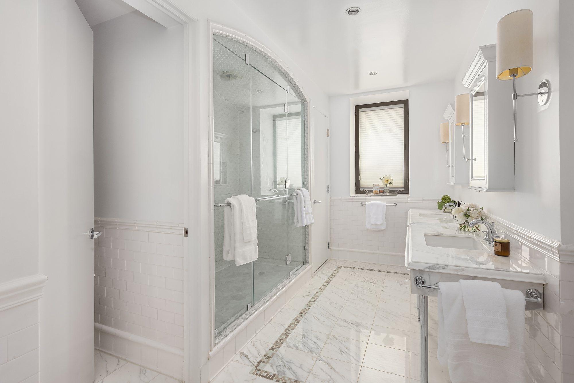 43 West 64th Street, Unit 7A Manhattan, NY 10023 - Photo 13 of 20 a bathroom with a tub sink and mirror