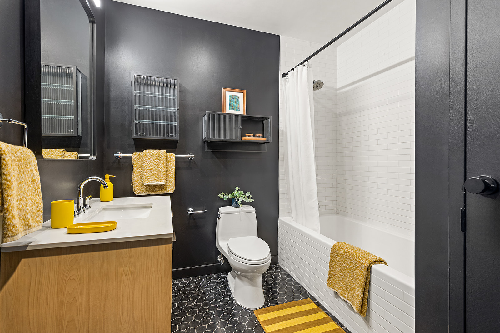 91 Grand Avenue, Unit 2A Brooklyn, NY 11205 - Photo 6 of 10 a bathroom with a sink toilet and shower
