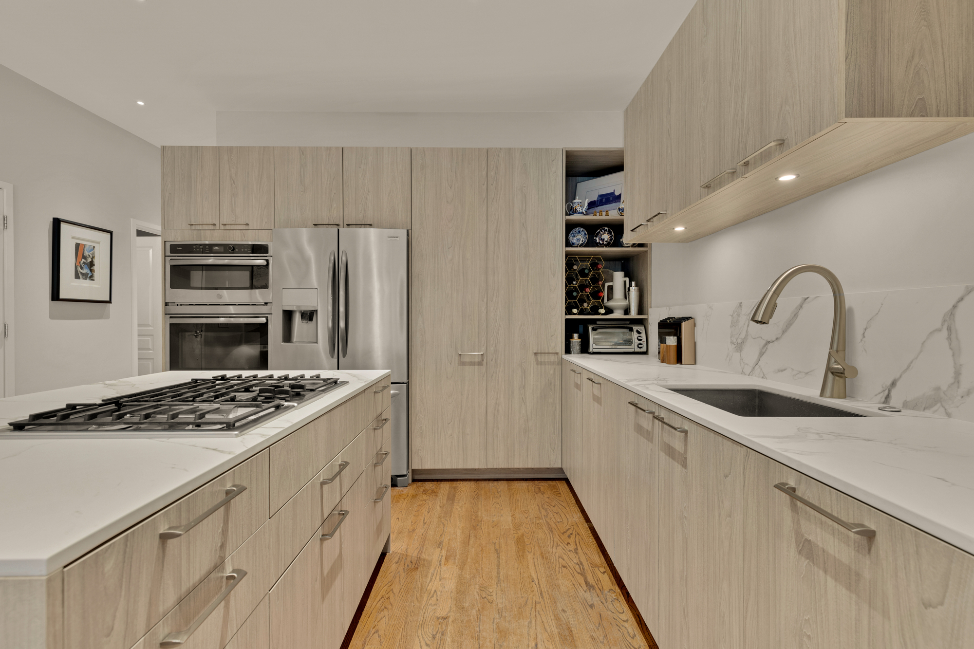 1407 15th Street Northwest, Unit 2 Washington, DC 20005 - Photo 6 of 24 a kitchen that has a sink and a stove