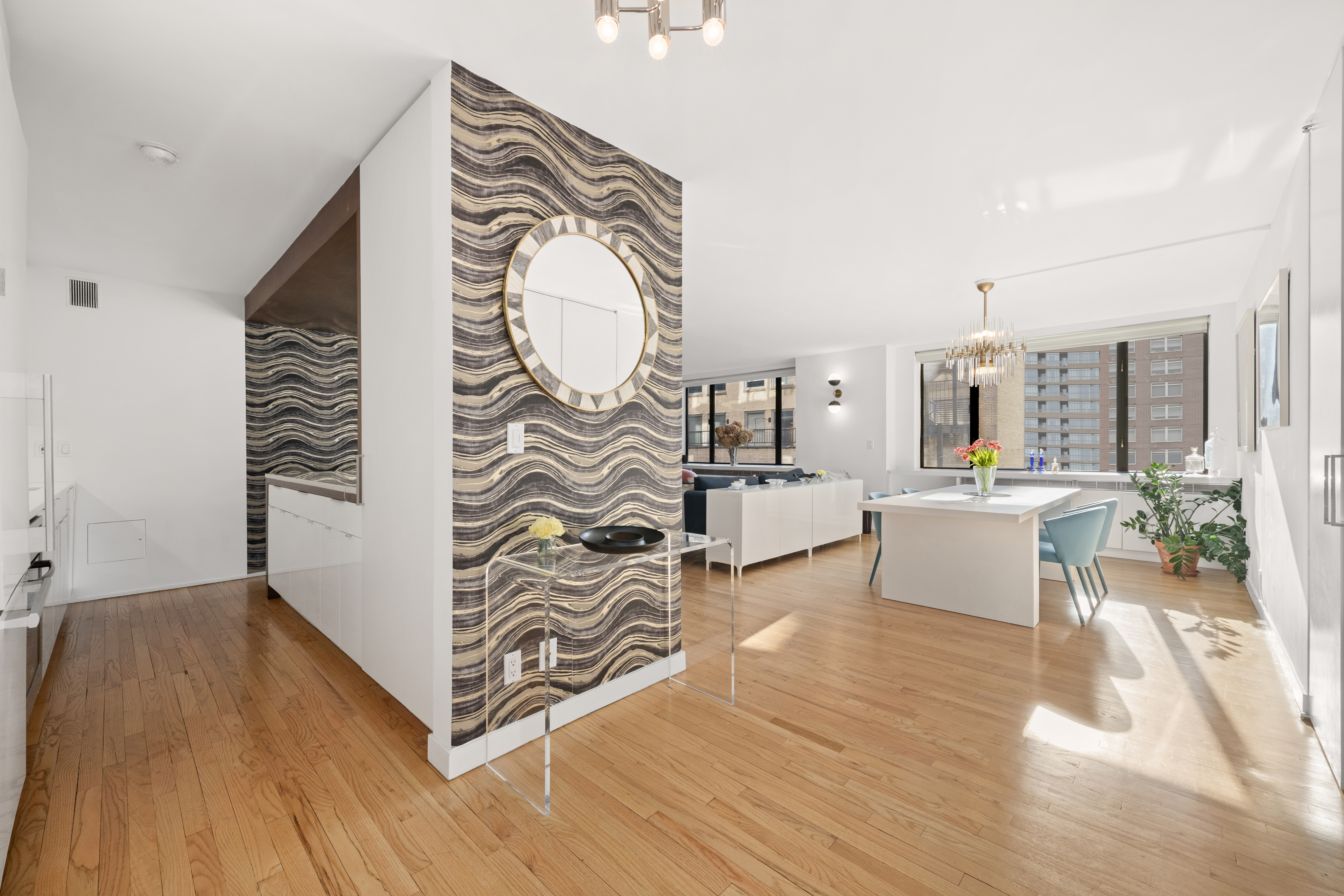 30 West 61st Street, Unit 9C Manhattan, NY 10023 - Photo 2 of 10 a living room with furniture and wooden floor