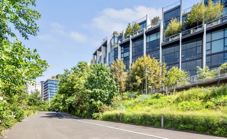 90 Furman Street, Unit N510 Brooklyn, NY 11201 - Photo 24 of 31 a front view of a house with a yard and potted plants