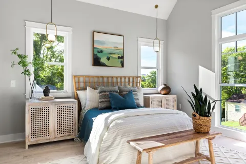 a bedroom with bed and a window