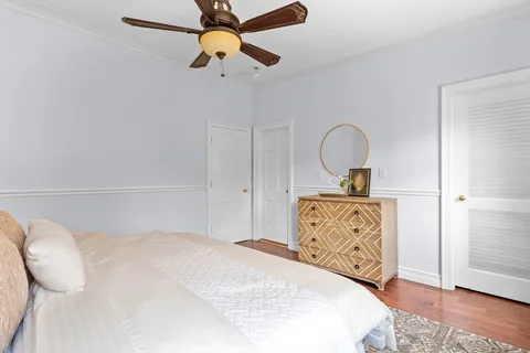 a bedroom with a bed and a dresser