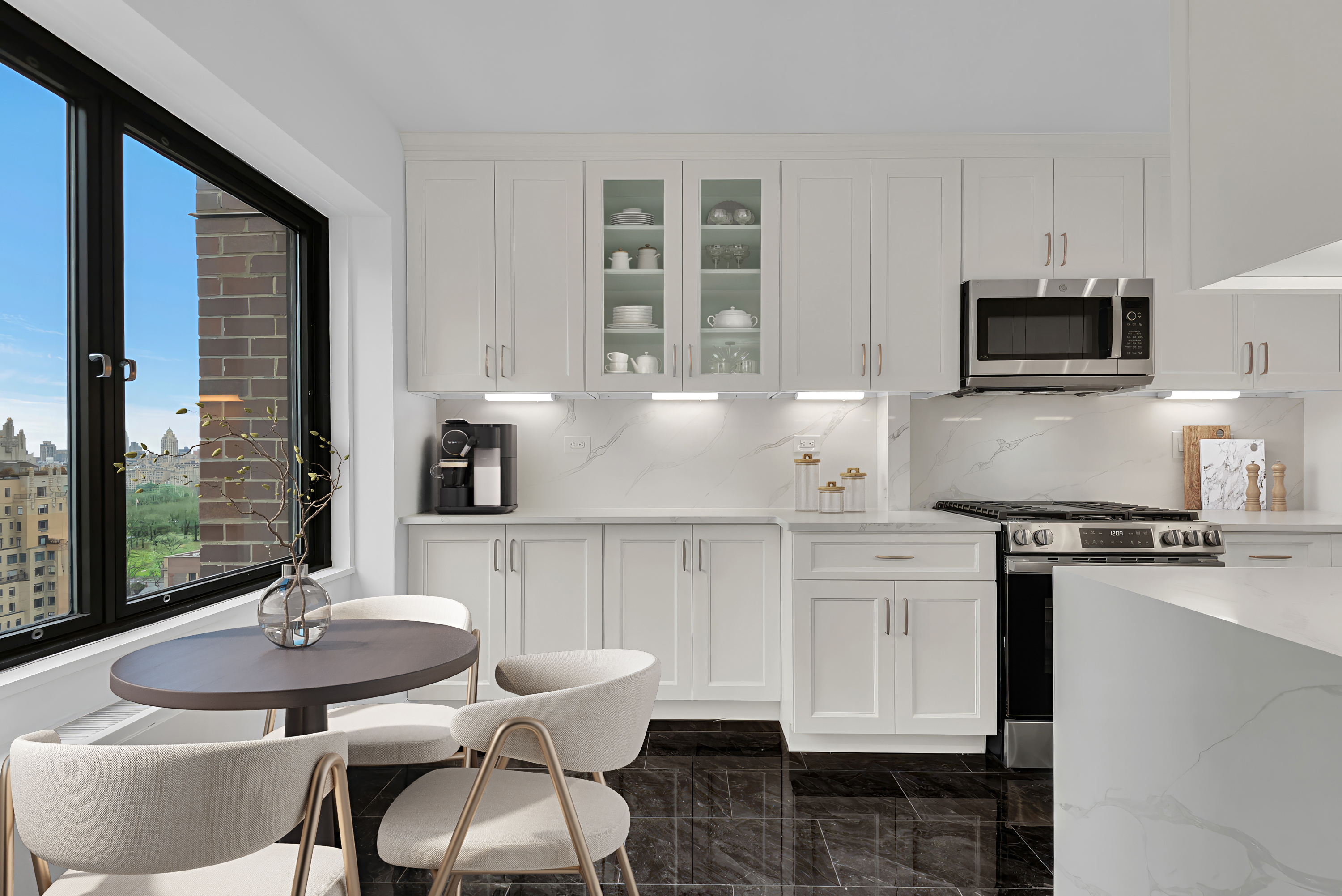 20 West 64th Street, Unit 20K Manhattan, NY 10023 - Photo 6 of 17 a kitchen with a stove a sink and a dining table