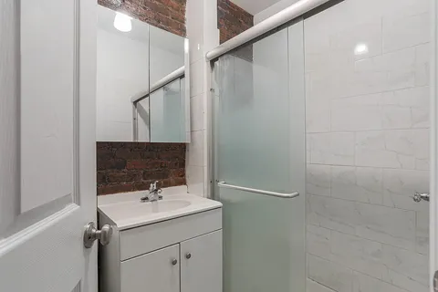 a bathroom with a sink and mirror