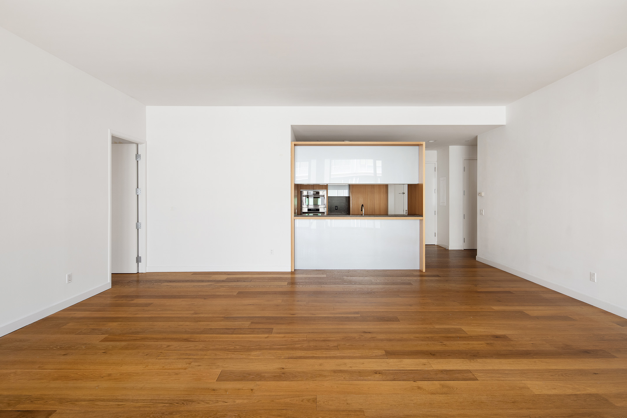 311 West Broadway, Unit 6J Manhattan, NY 10013 - Photo 5 of 19 a view of empty room with wooden floor