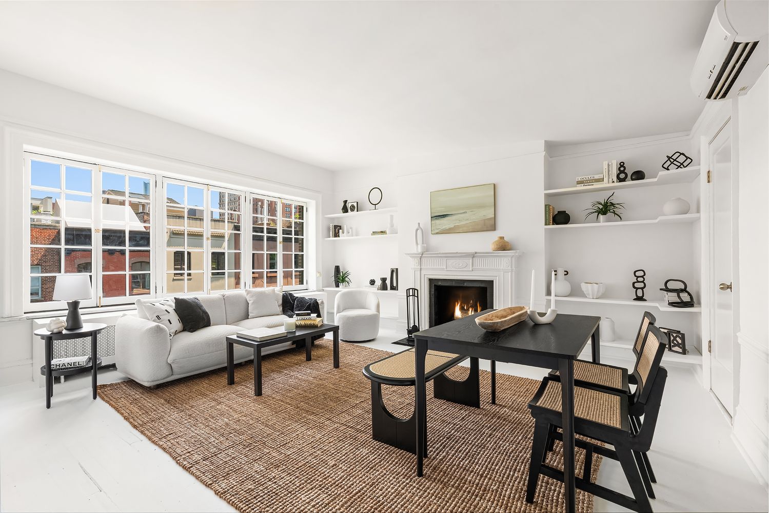 30-32 West 9th Street, Unit 5A Manhattan, NY 10011 - Photo 2 of 18 a living room with furniture and a fireplace