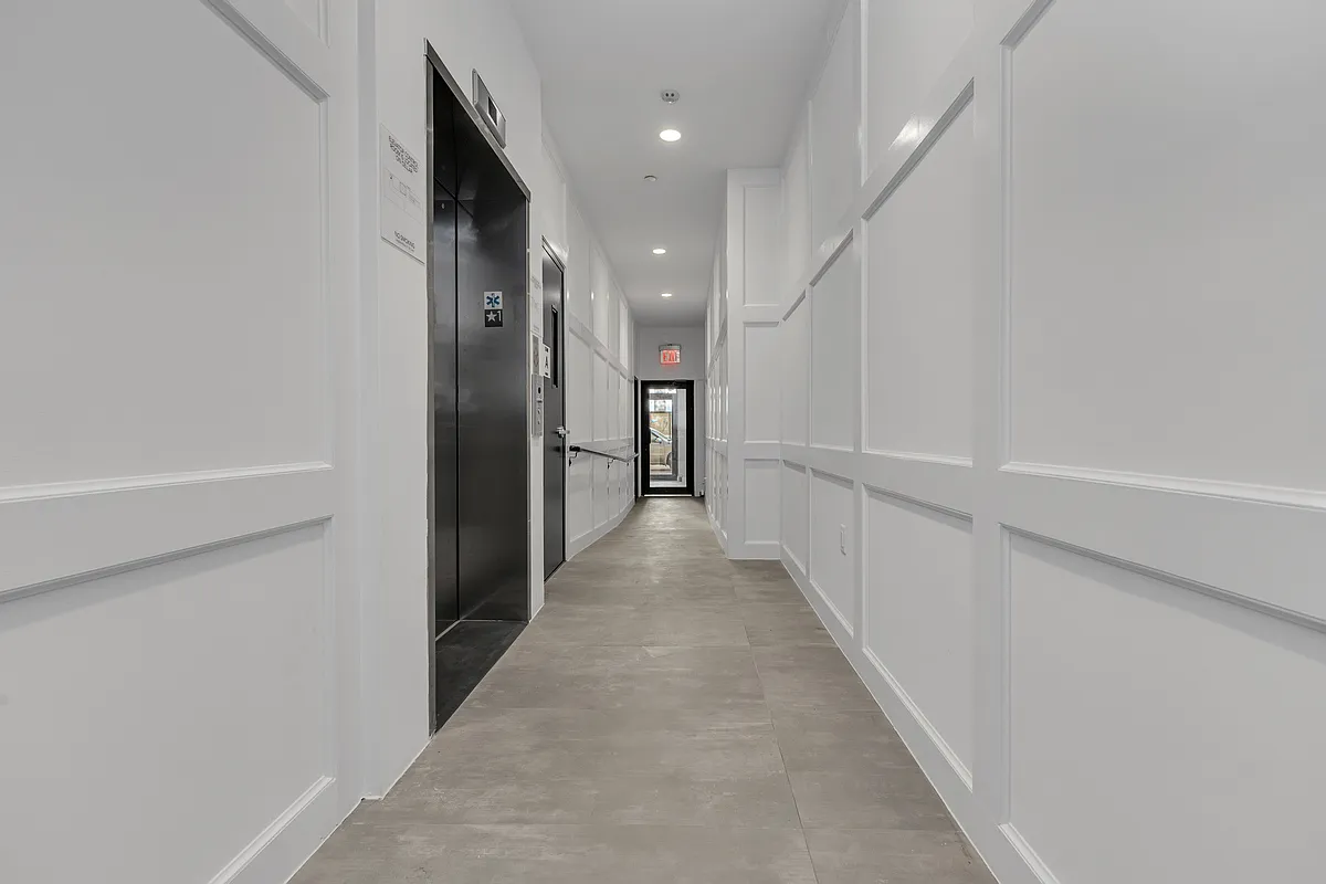 21-10 31st Avenue, Unit 6R Queens, NY 11106 - Photo 12 of 17 a view of a hallway with an entryway