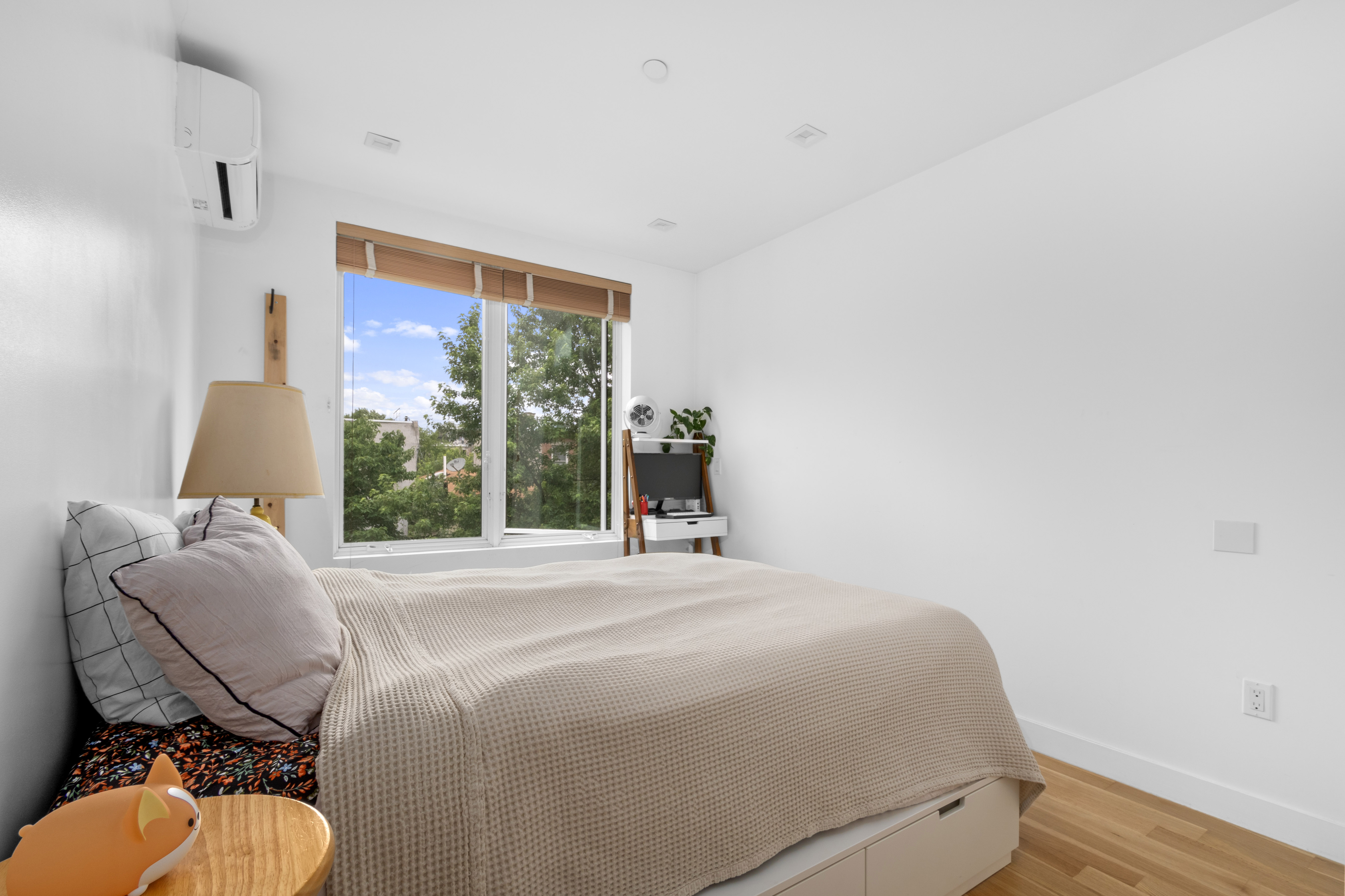 203 Quincy Street, Unit 4B Brooklyn, NY 11216 - Photo 5 of 11 a bedroom with a bed and a window