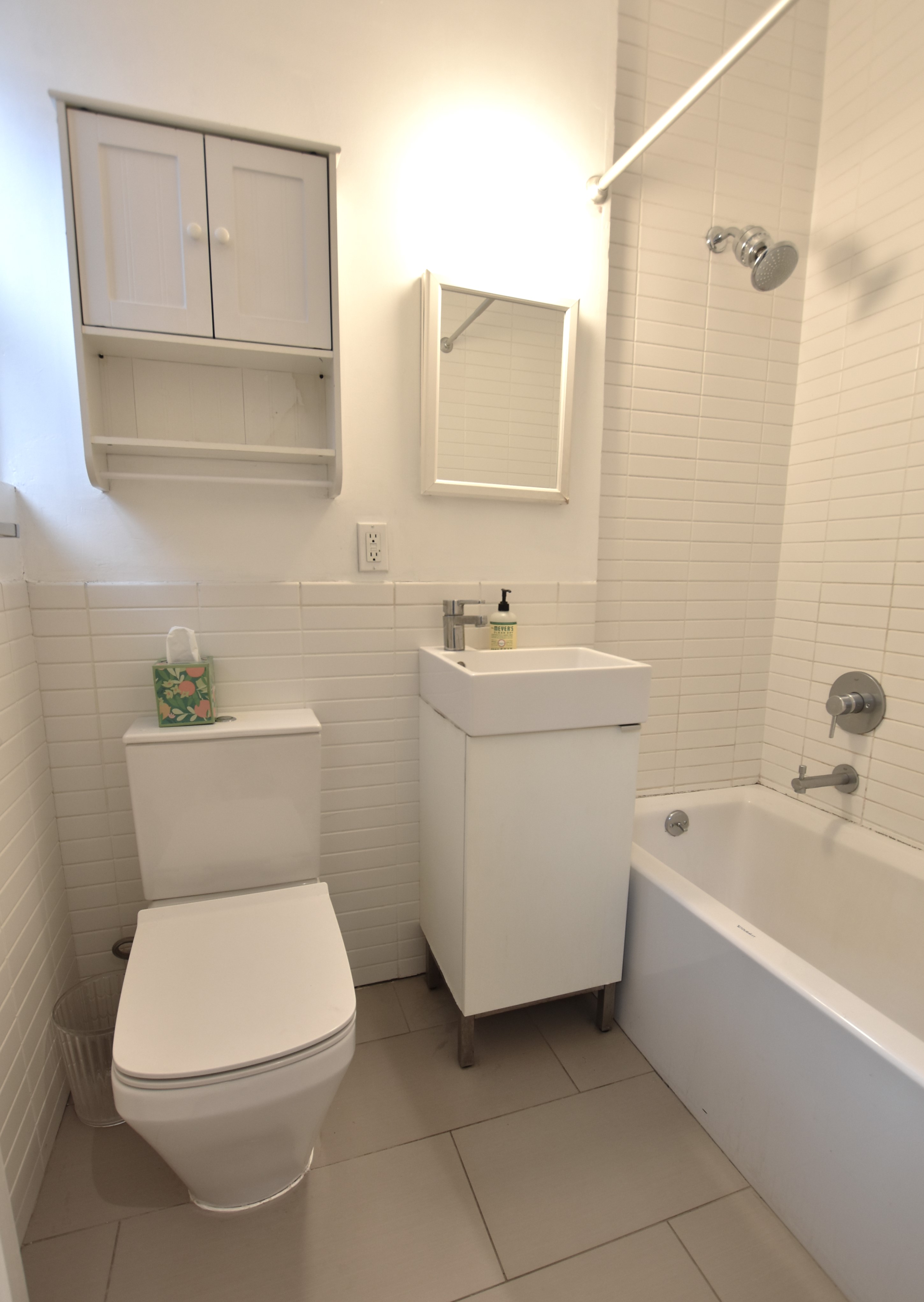 172 5th Avenue, Unit 2F Manhattan, NY 10010 - Photo 7 of 10 a bathroom with a toilet sink and bathtub