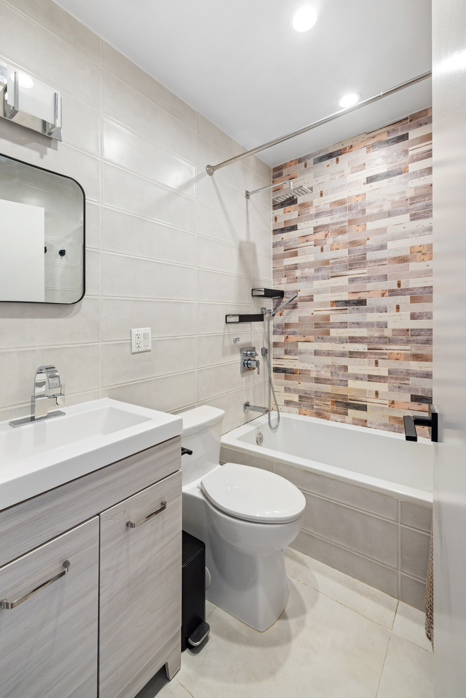 479 Monroe Street, Unit 2F Brooklyn, NY 11221 - Photo 5 of 6 a bathroom with a sink toilet and shower