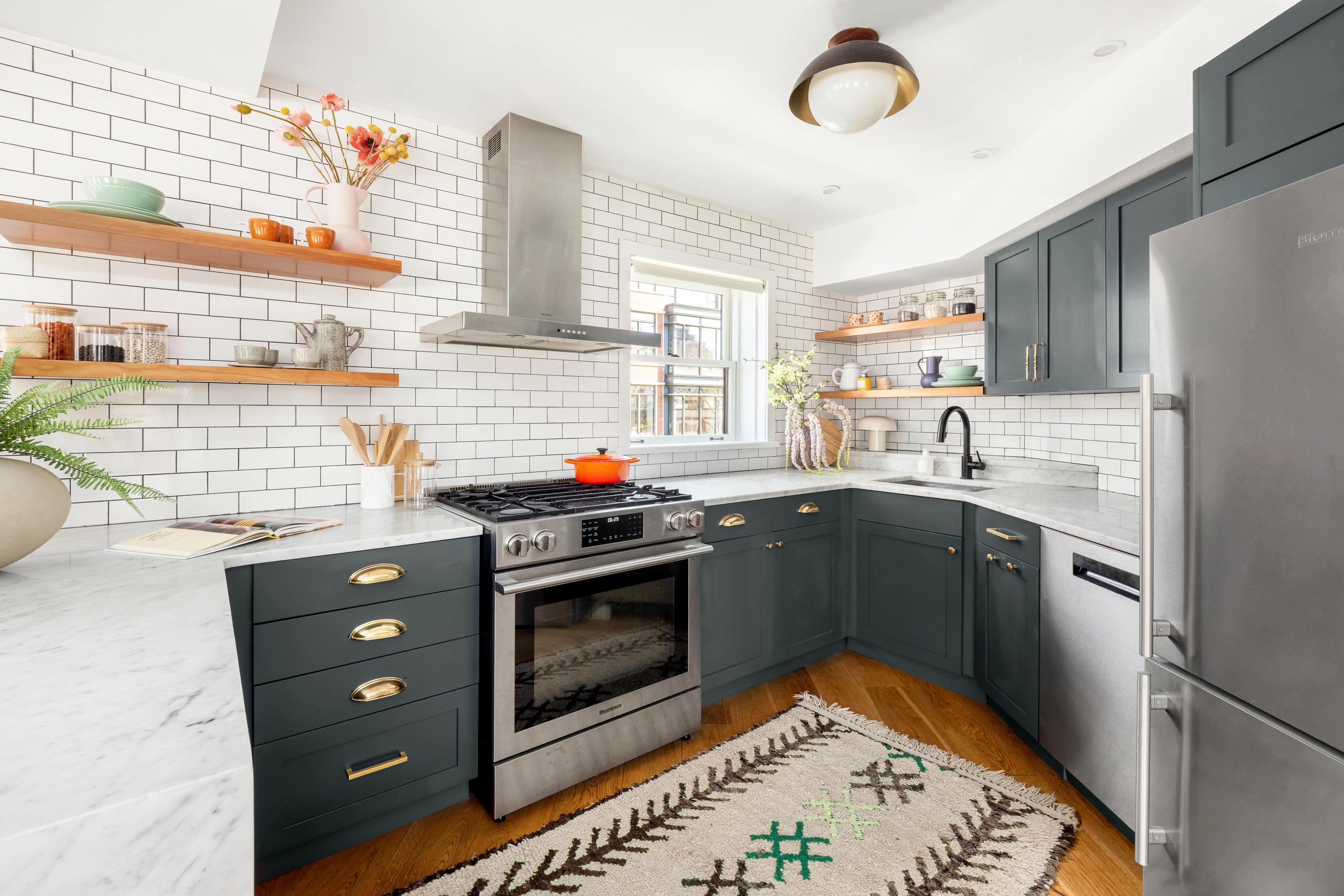 160 West 11th Street, Unit PH Manhattan, NY 10011 - Photo 6 of 16 a kitchen with stainless steel appliances granite countertop a stove a sink and a refrigerator