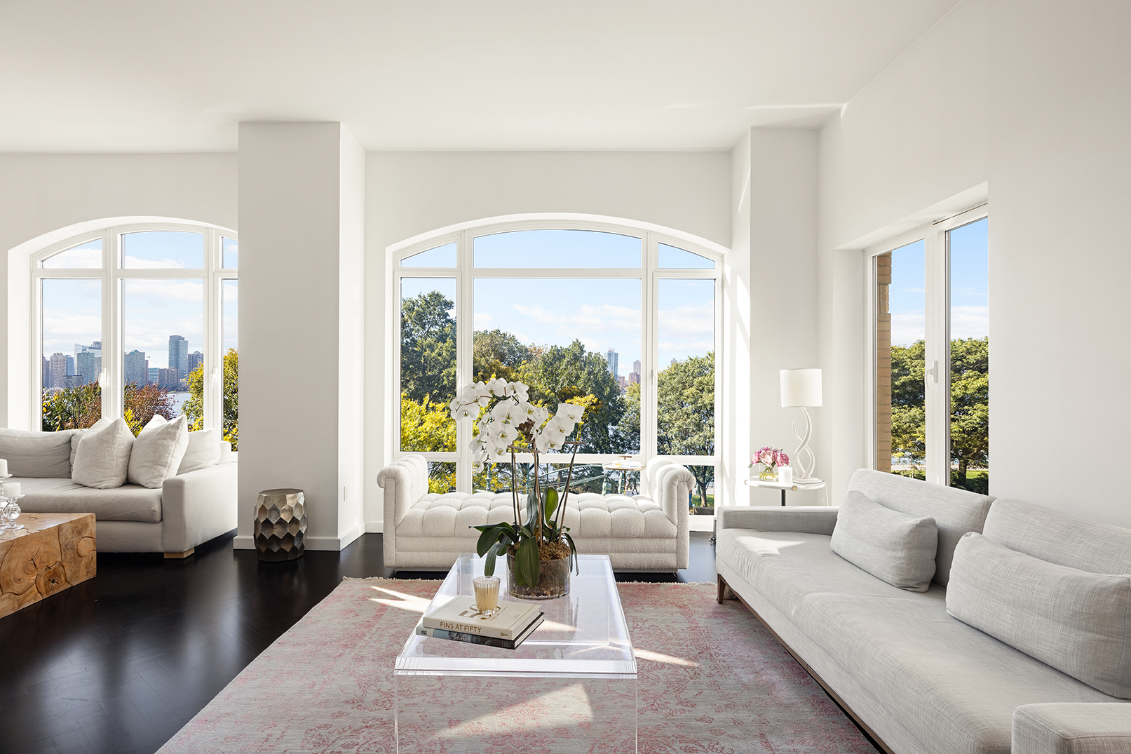 400 West 12th Street, Unit 4J Manhattan, NY 10014 - Photo 5 of 21 a living room with furniture and a large window