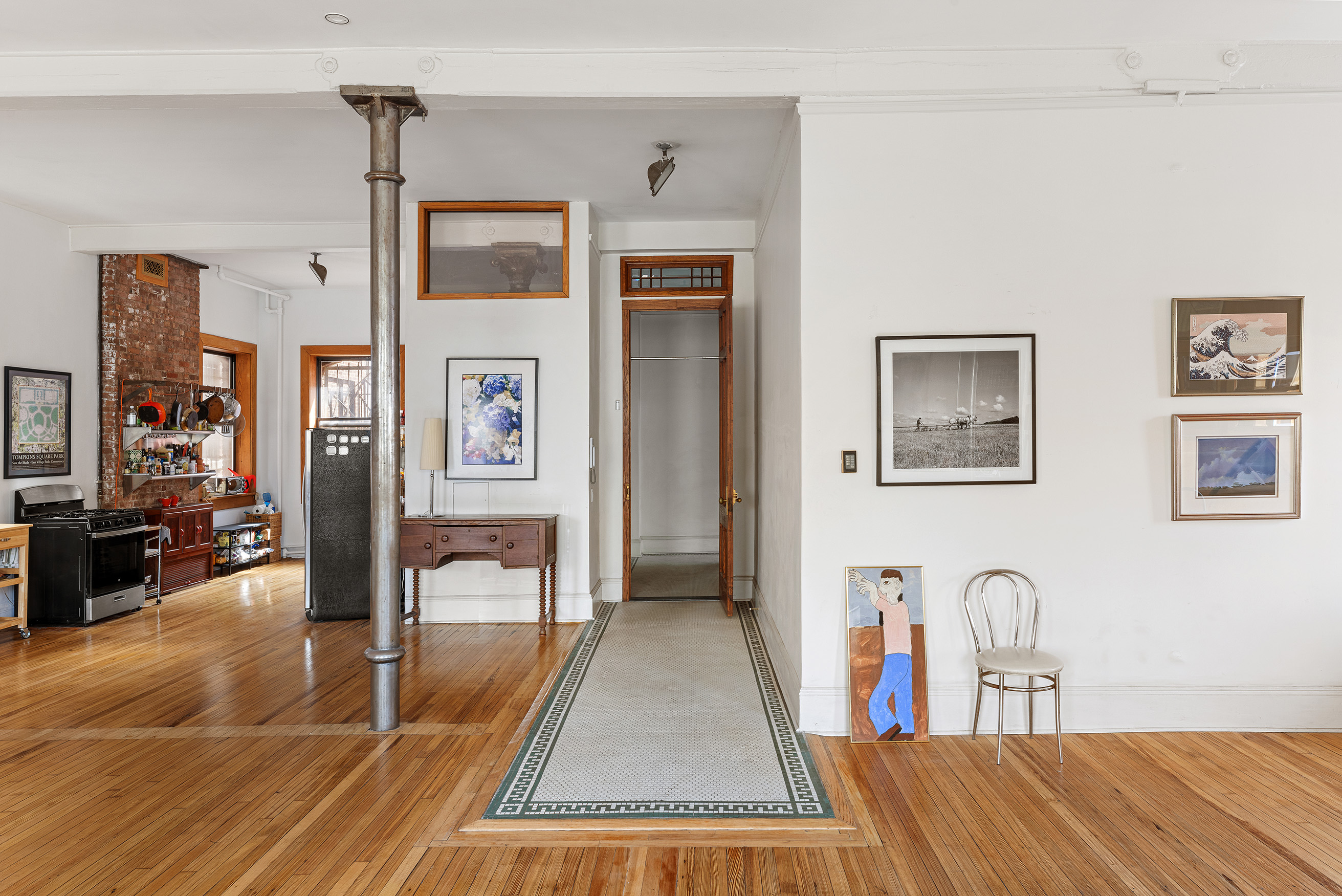 295 East 8th Street, Unit 3W Manhattan, NY 10009 - Photo 12 of 18 a living room with furniture and a table