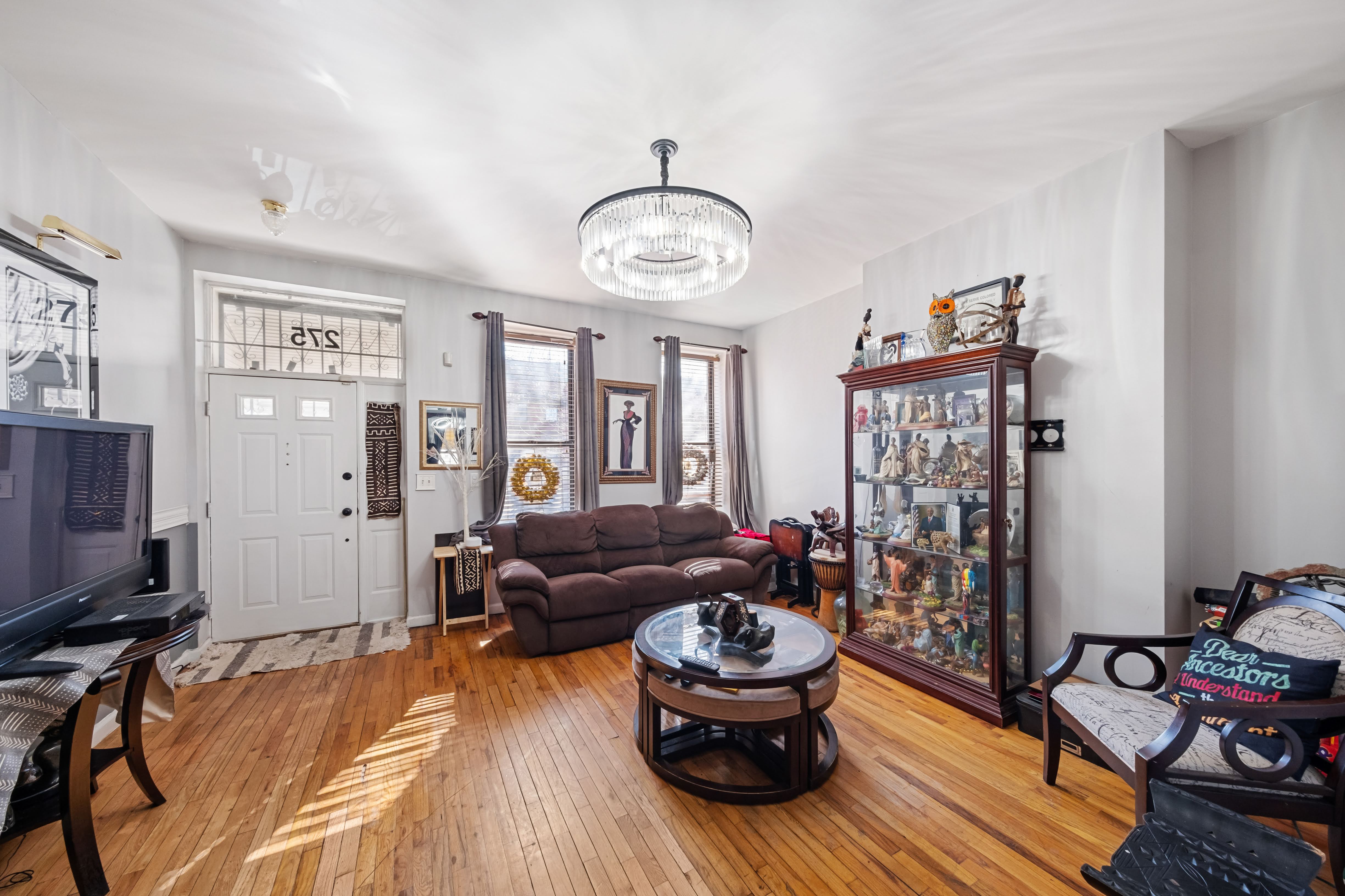 275 Van Buren Street Brooklyn, NY 11221 - Photo 3 of 33 a living room with furniture and a window