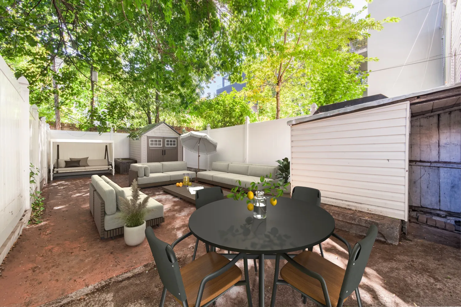 a backyard of a house with table and chairs