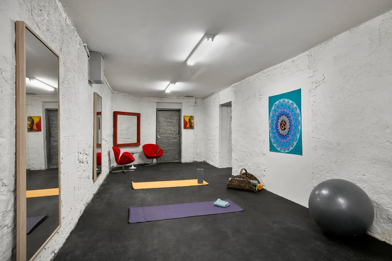 a room with gym equipment and a window