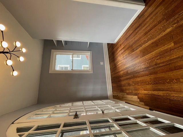 340 Marlborough Road Brooklyn, NY 11226 - Photo 15 of 27 a view of an empty room with wooden floor and a window