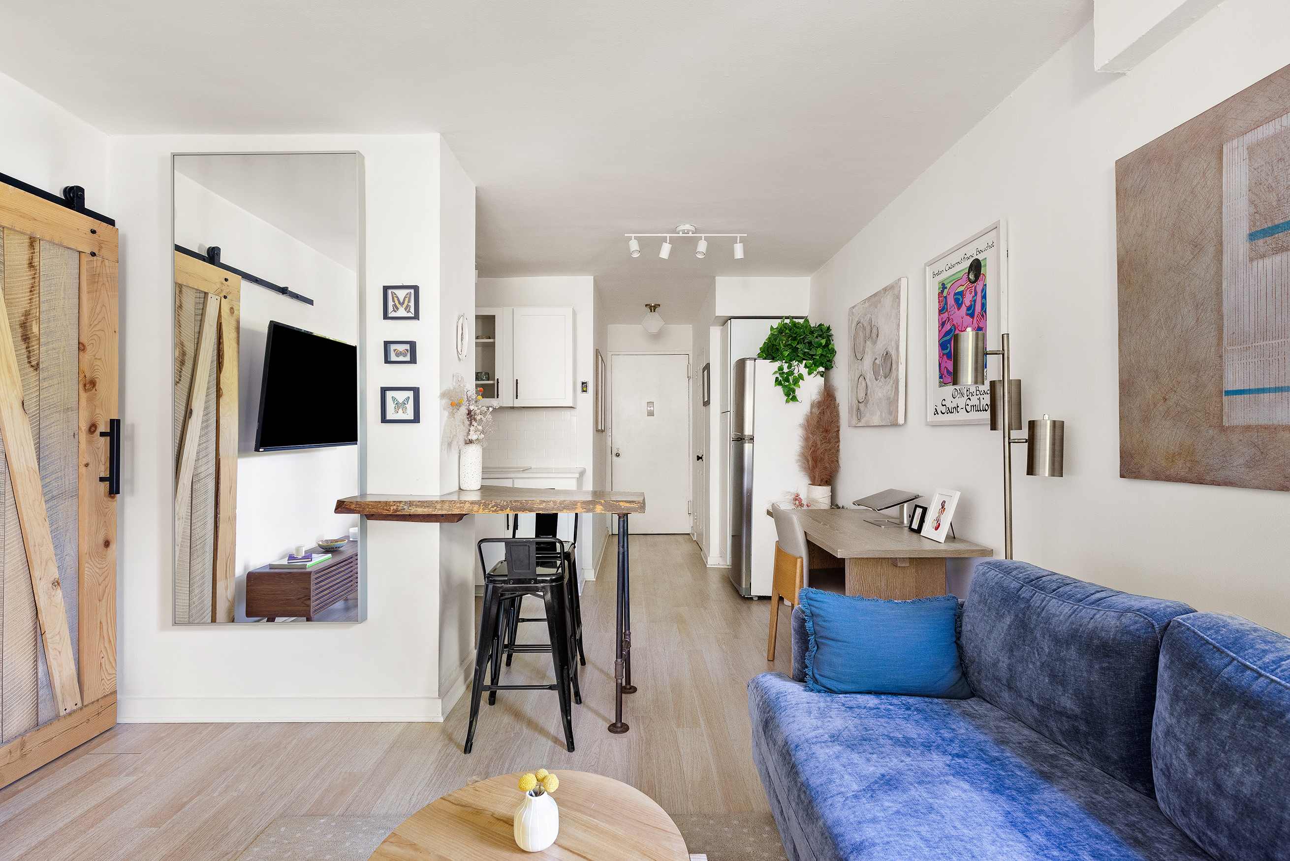 191 Willoughby Street, Unit 4F Brooklyn, NY 11201 - Photo 2 of 6 a living room with furniture wooden floor and a flat screen tv