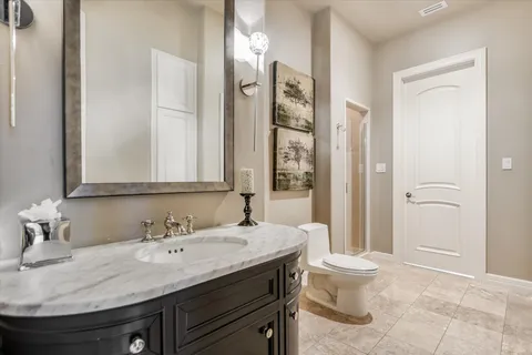 a en suite bathroom with a sink and a mirror