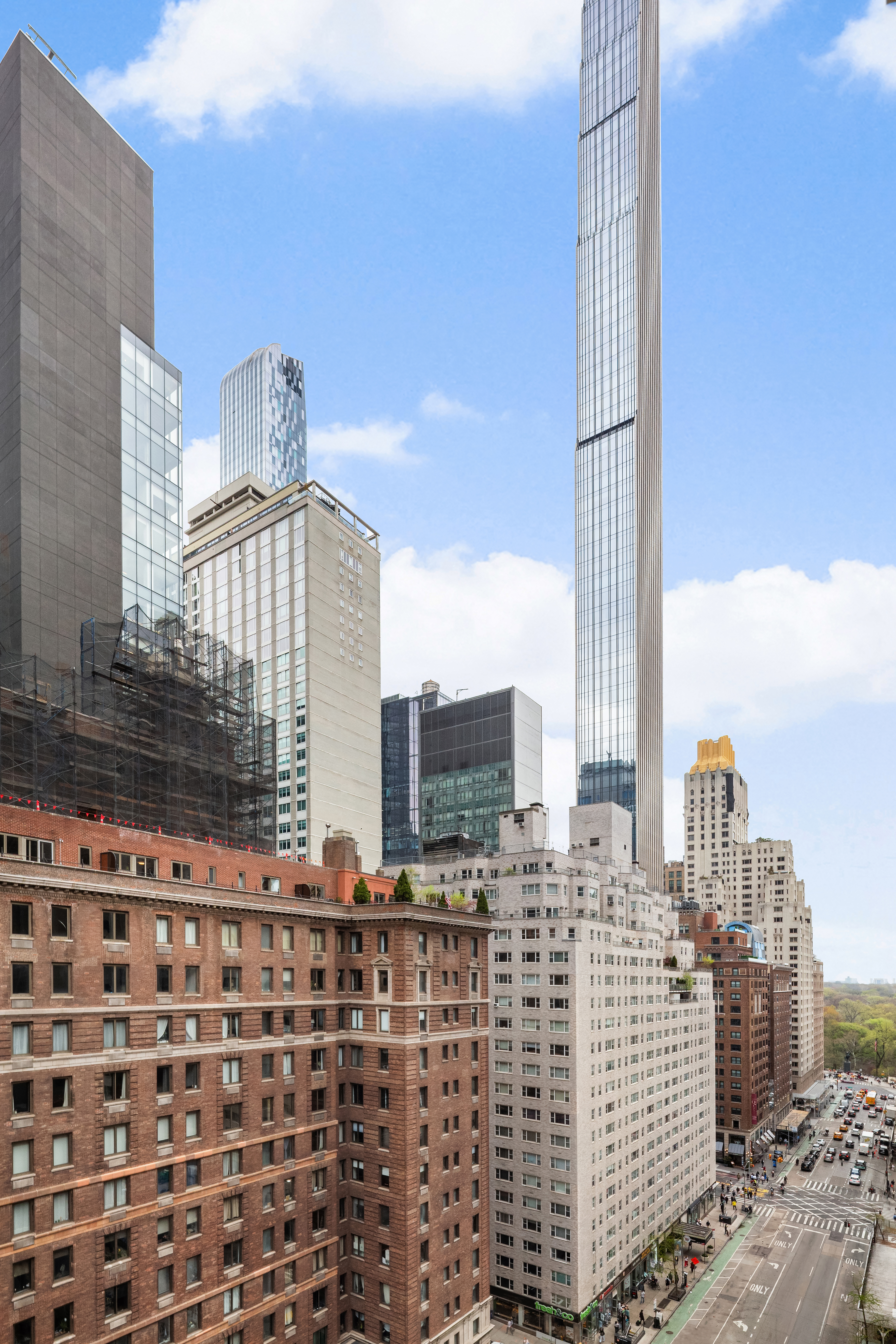 77 West 55th Street, Unit 17F Manhattan, NY 10019 - Photo 7 of 12 a view of a building with city street