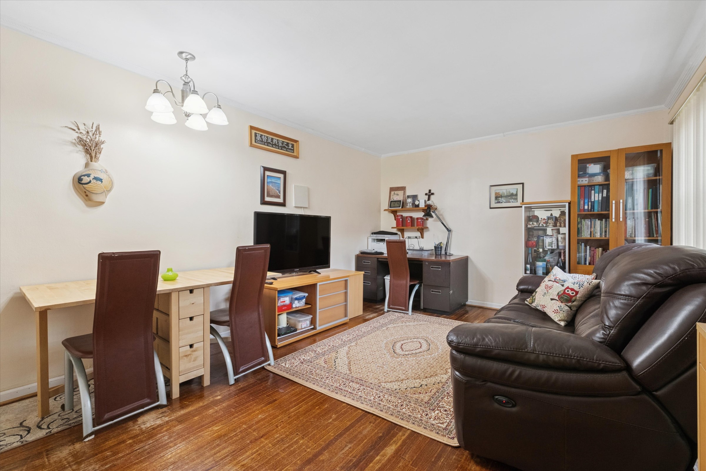 74-22 220th Street Oakland Garden, NY 11364 - Photo 3 of 16 a living room with furniture and a flat screen tv