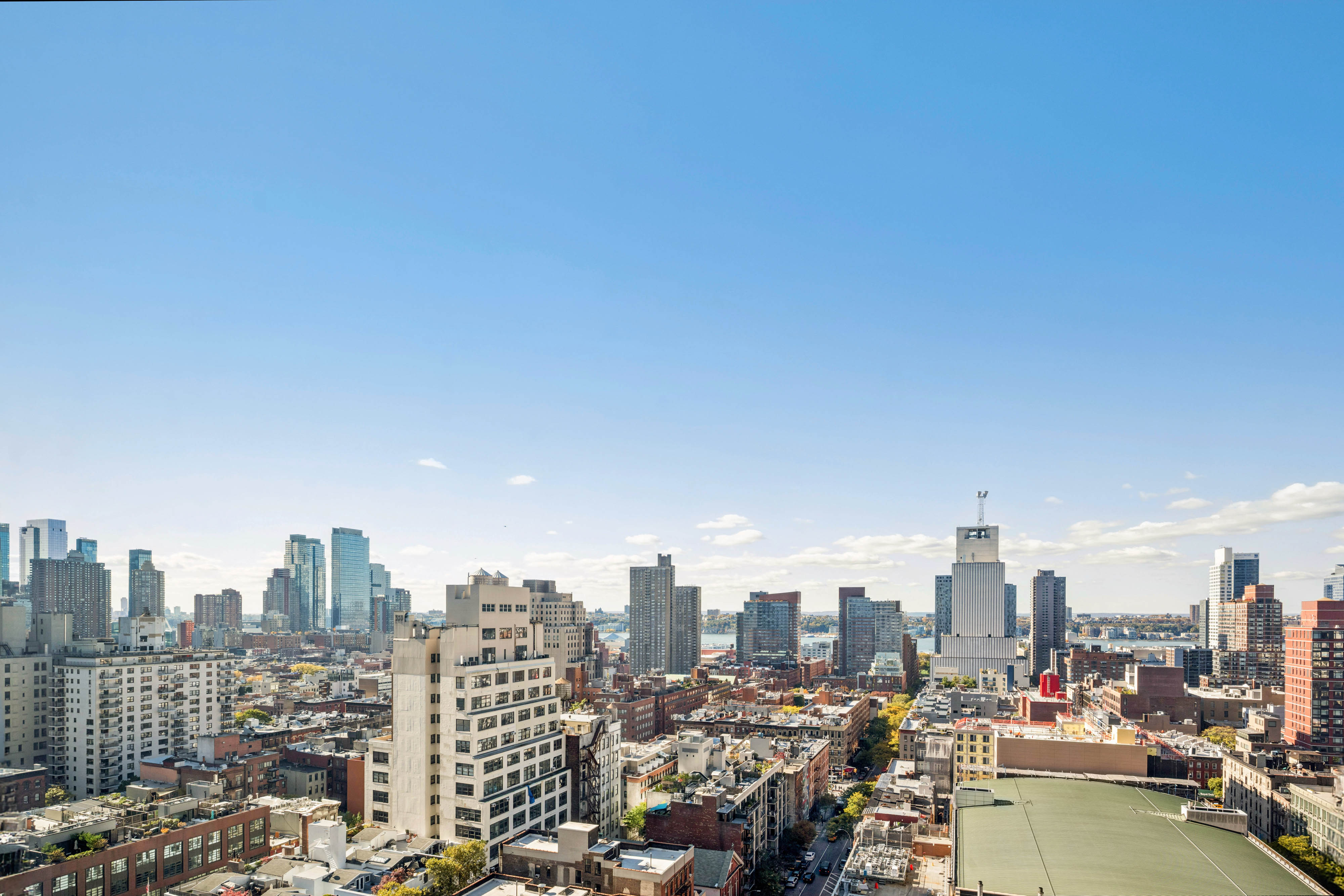 301 West 53rd Street, Unit 21B Manhattan, NY 10019 - Photo 7 of 20 a view of a city with tall buildings in the background