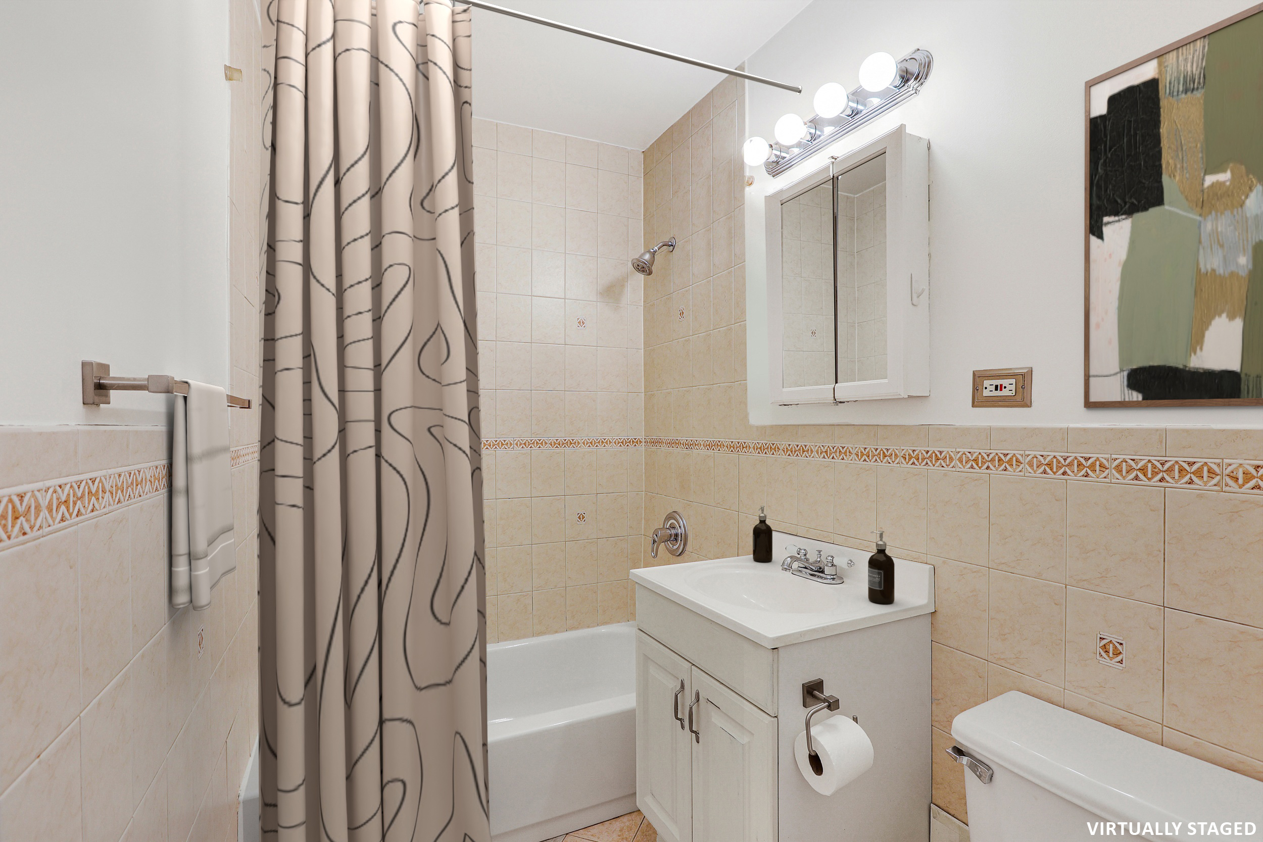 315 7th Avenue, Unit 10E Manhattan, NY 10001 - Photo 9 of 13 a bathroom with a sink a toilet and shower