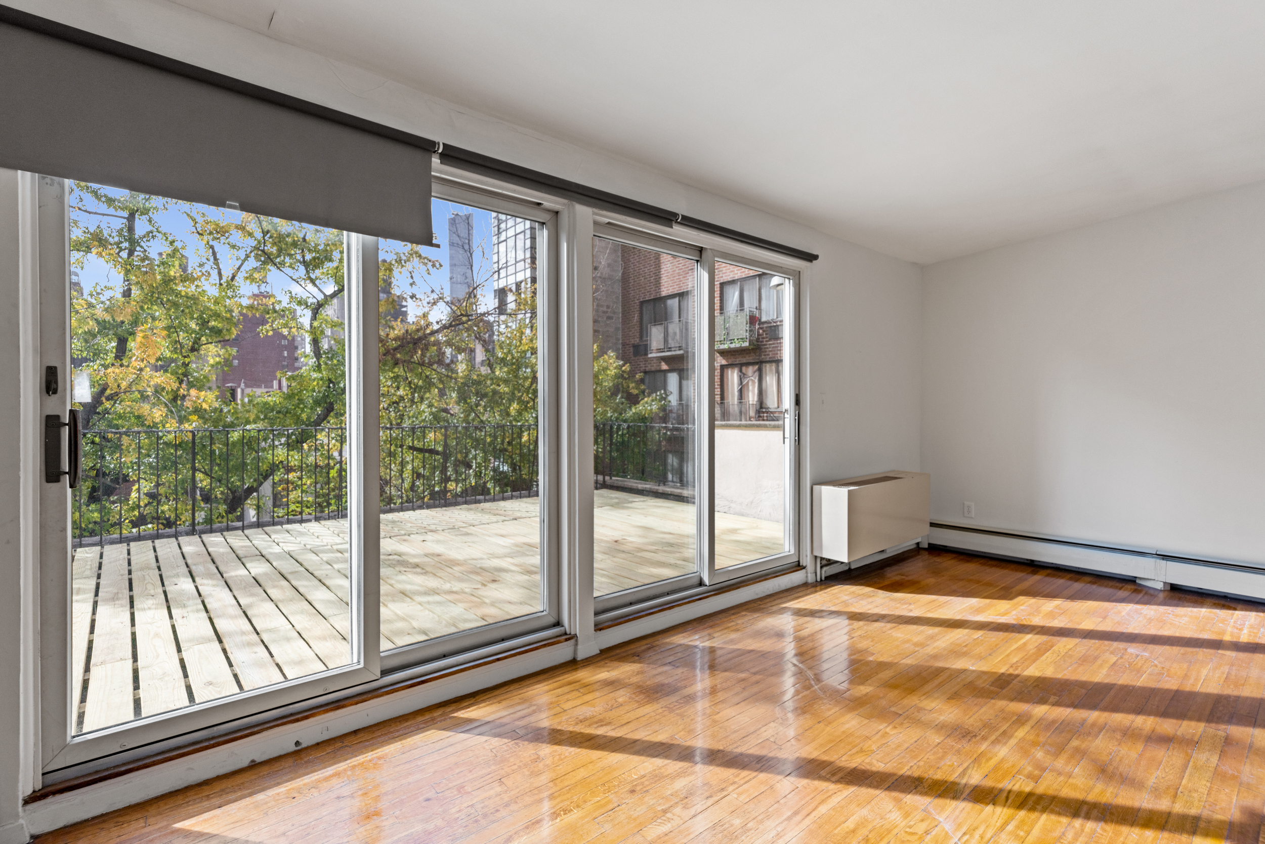 136 East 30th Street, Unit 3R Manhattan, NY 10016 - Photo 16 of 23 a view of an empty room and window