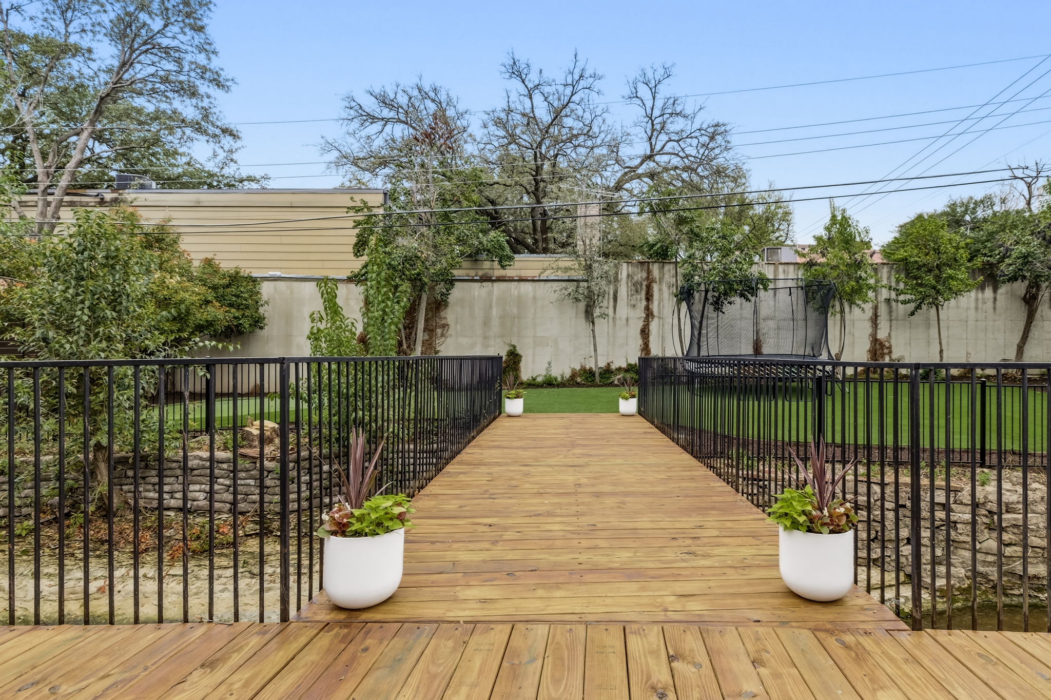 5765 Stonegate Road Dallas, TX 75209 - Photo 32 of 37 a view of outdoor space with deck having patio