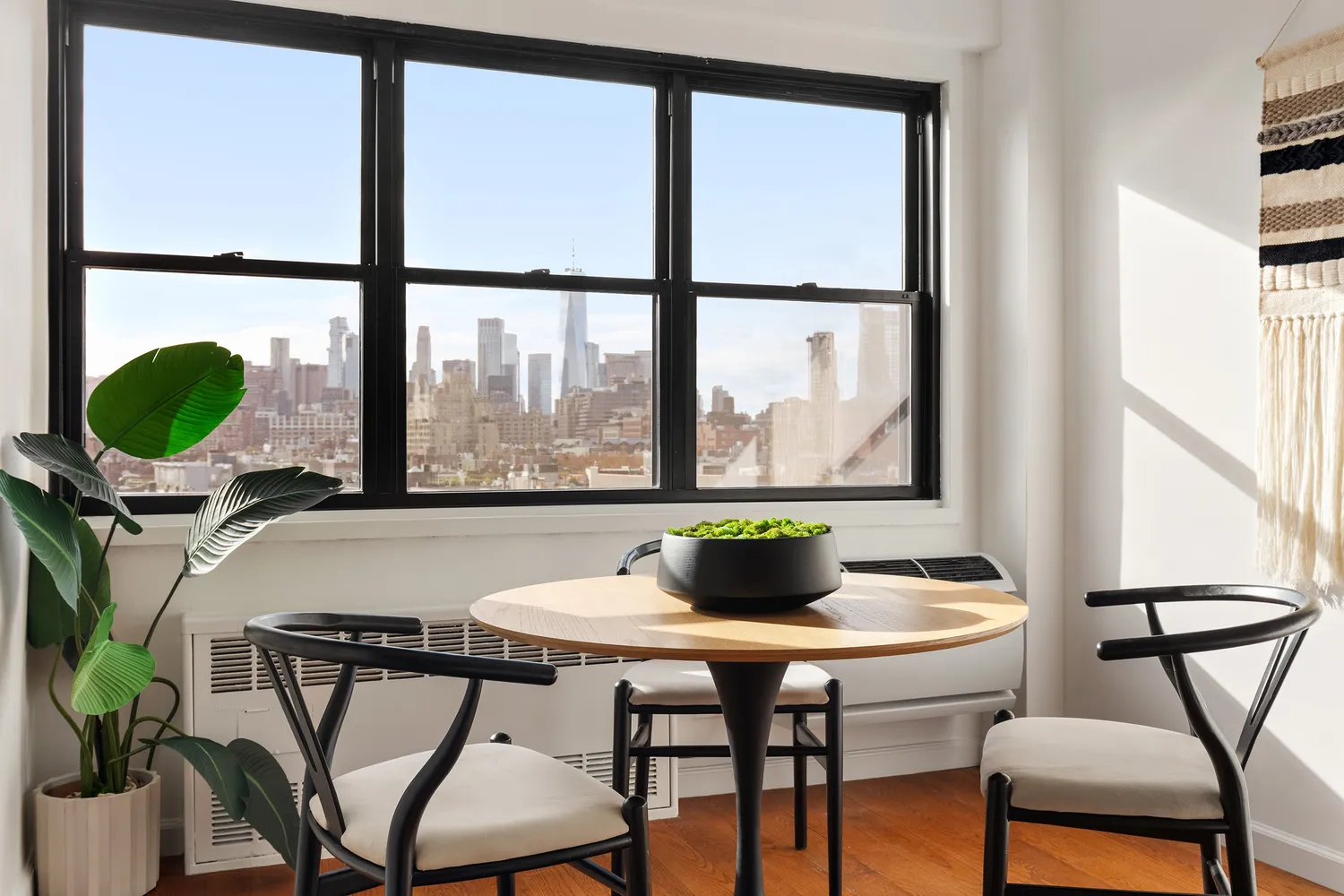 a kitchen with stainless steel appliances granite countertop a stove a sink and white cabinets