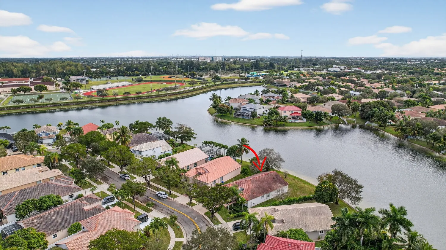 an aerial view of a house with a garden and plants