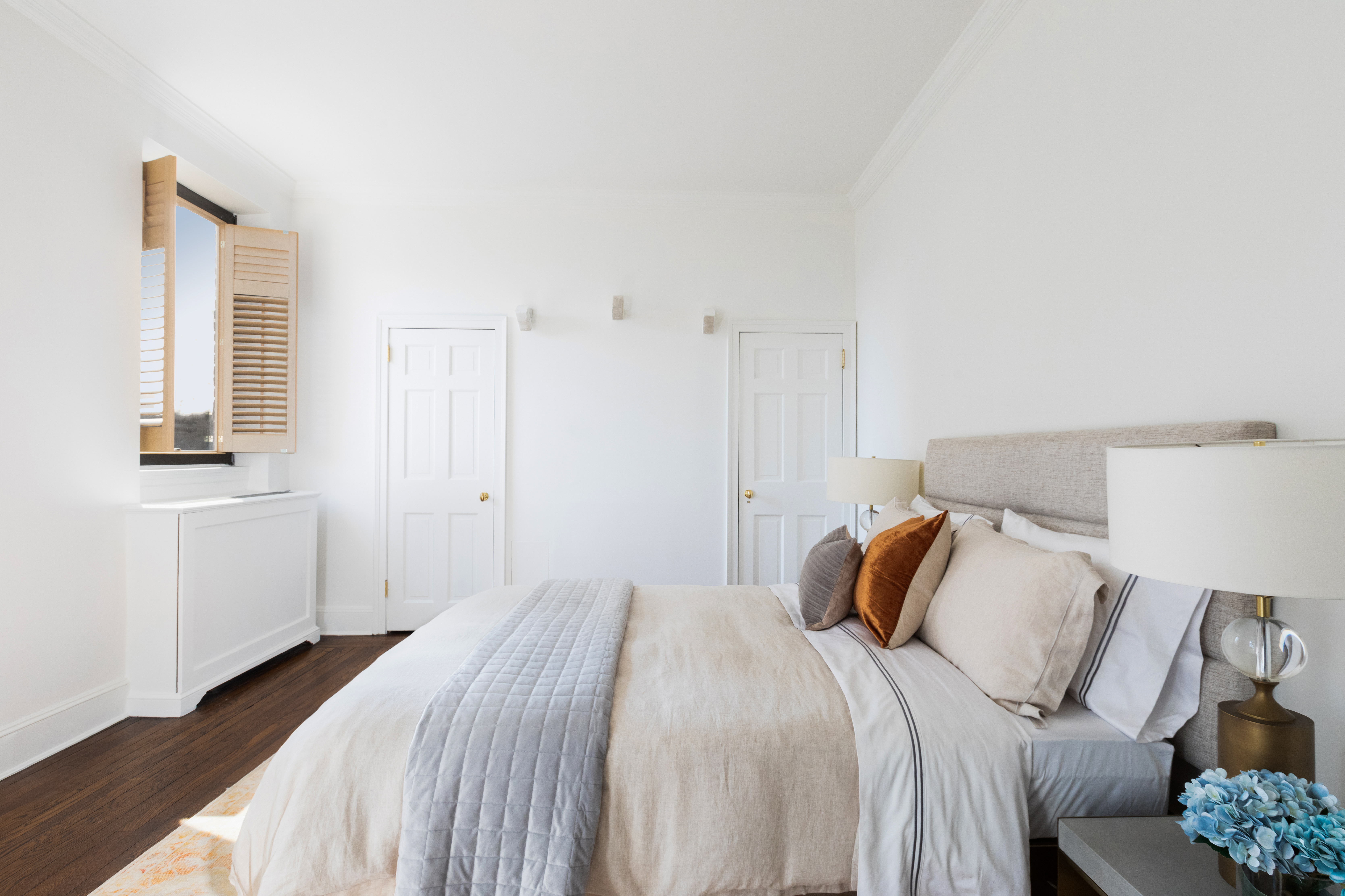 1070 Park Avenue, Unit PHE Manhattan, NY 10128 - Photo 9 of 14 a bedroom with a bed and a window