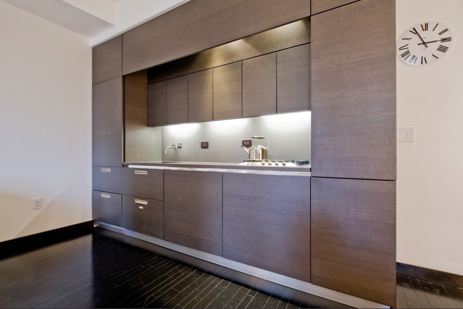 20 Pine Street, Unit 1415 Manhattan, NY 10005 - Photo 2 of 8 a bathroom with a cabinet and mirror