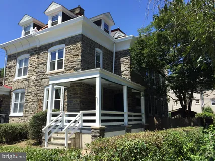 front view of a house with a small yard