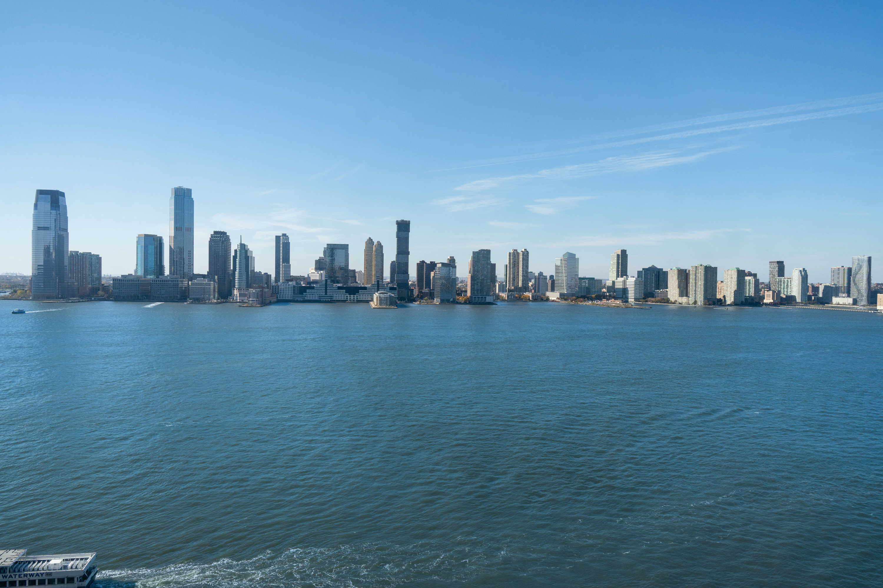 212 Warren Street, Unit 20A Manhattan, NY 10282 - Photo 5 of 23 a view of a city with tall buildings in the background